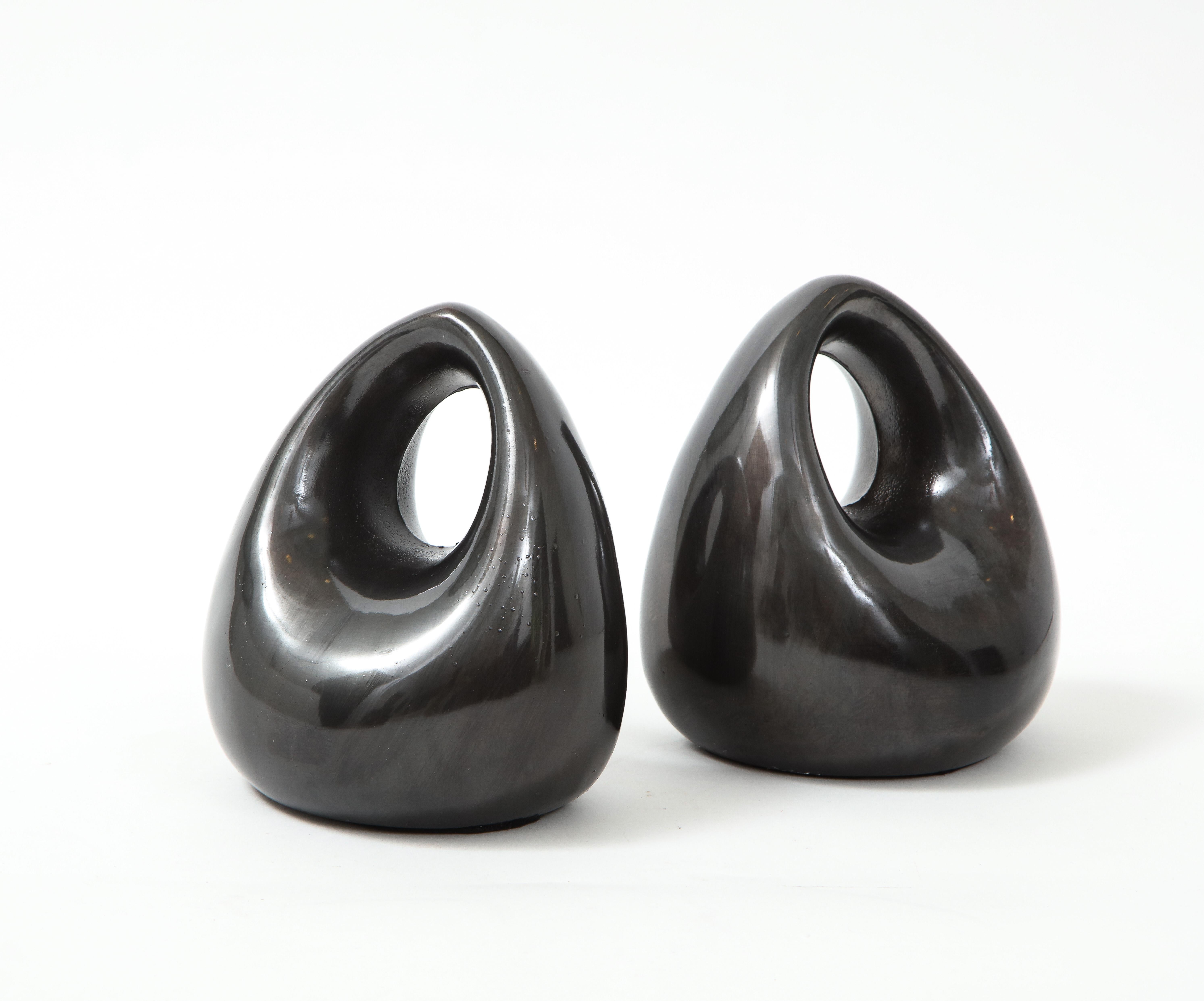 Pair of Modernist stirrup bookends in a custom blackened bronze finish. Ben Seibel, c60s.