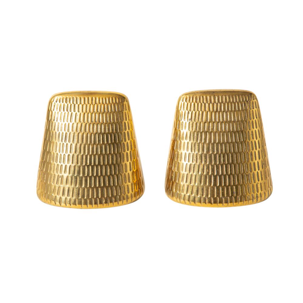 Ben Seibel Jenfred-ware for Raymor bookends, brass, impressed, textured, signed. Small scale brass over white metal wedge form bookends decorated with a pattern of impressed vertical dashes. The finish is bright with a warm patina. Signed on the