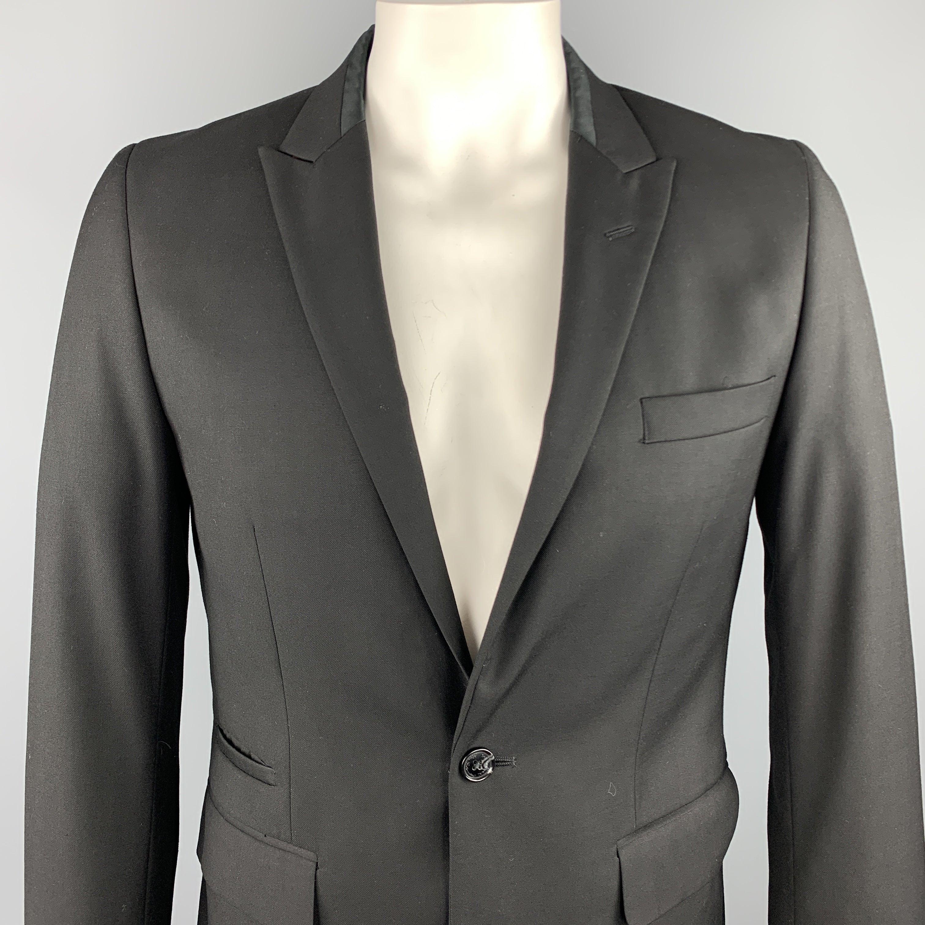 BEN SHERMAN sport coat comes in a black polyester featuring a peak lapel style, flap pockets, red silk liner, and a single button closure.
Excellent
Pre-Owned Condition. 

Marked:   US L
 

Measurements: 
 
Shoulder: 17 inches 
Chest: 41 inches