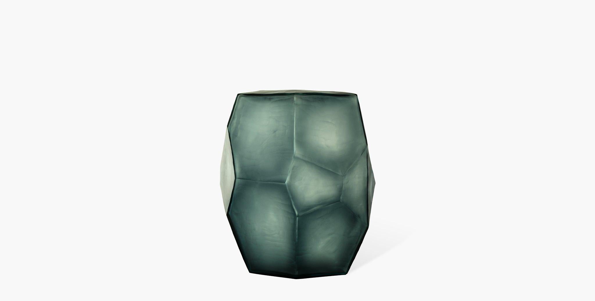 Our Arroyo Glass Vases are hand-blown and chiseled from a deep ocean blue indigo matte glass and formed into a tall diamond geometric vessel. Available in three sizes, pair with your favorite console table for a sea-inspired home