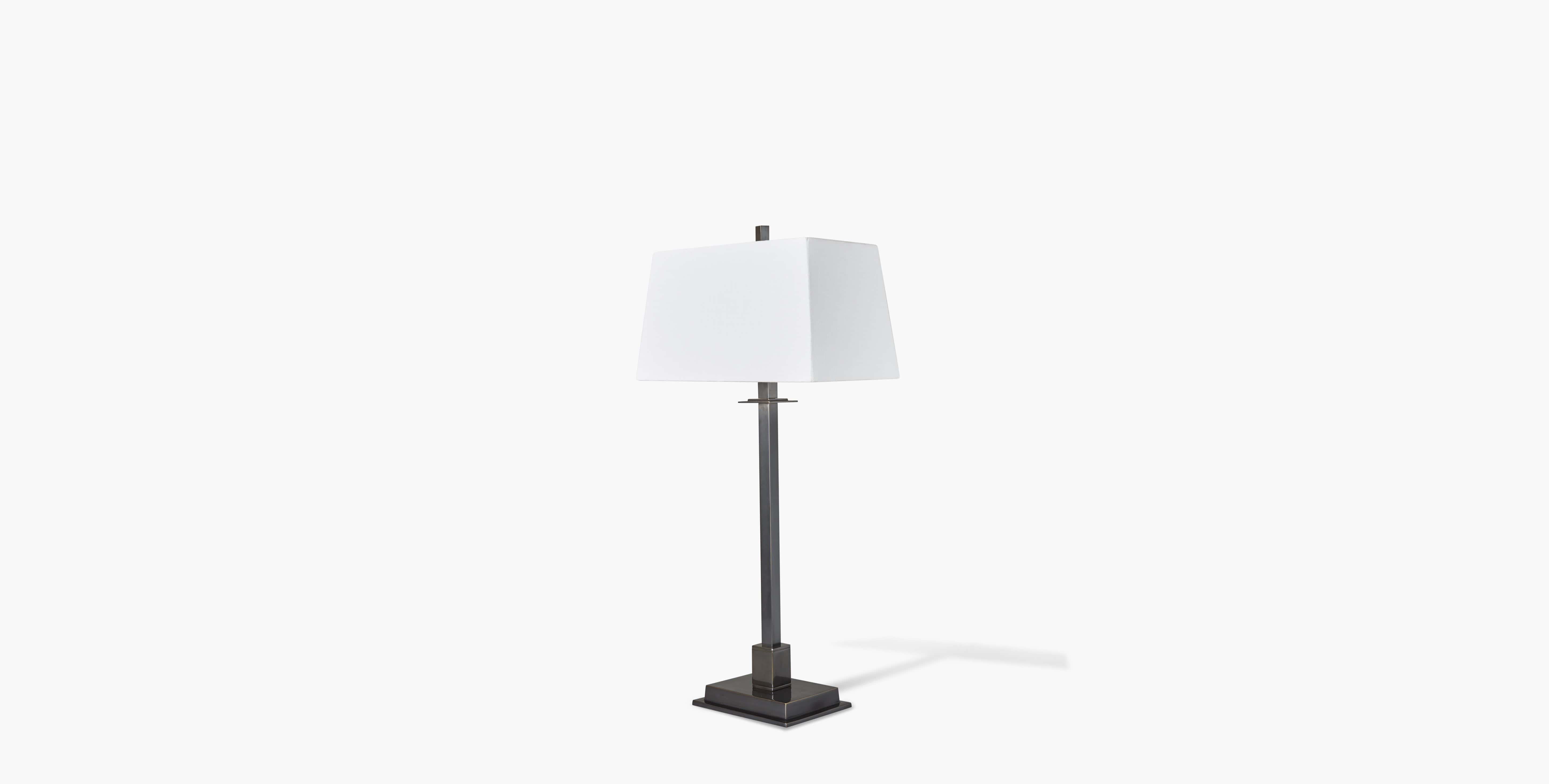 Our Ashton Lamp offers a sleek and modernized version of the classic candlestick silhouette that compliments any room, design, or style. Our handcrafted fabrics, leathers, and finishes are inspired by the natural variations within fibers, textures,