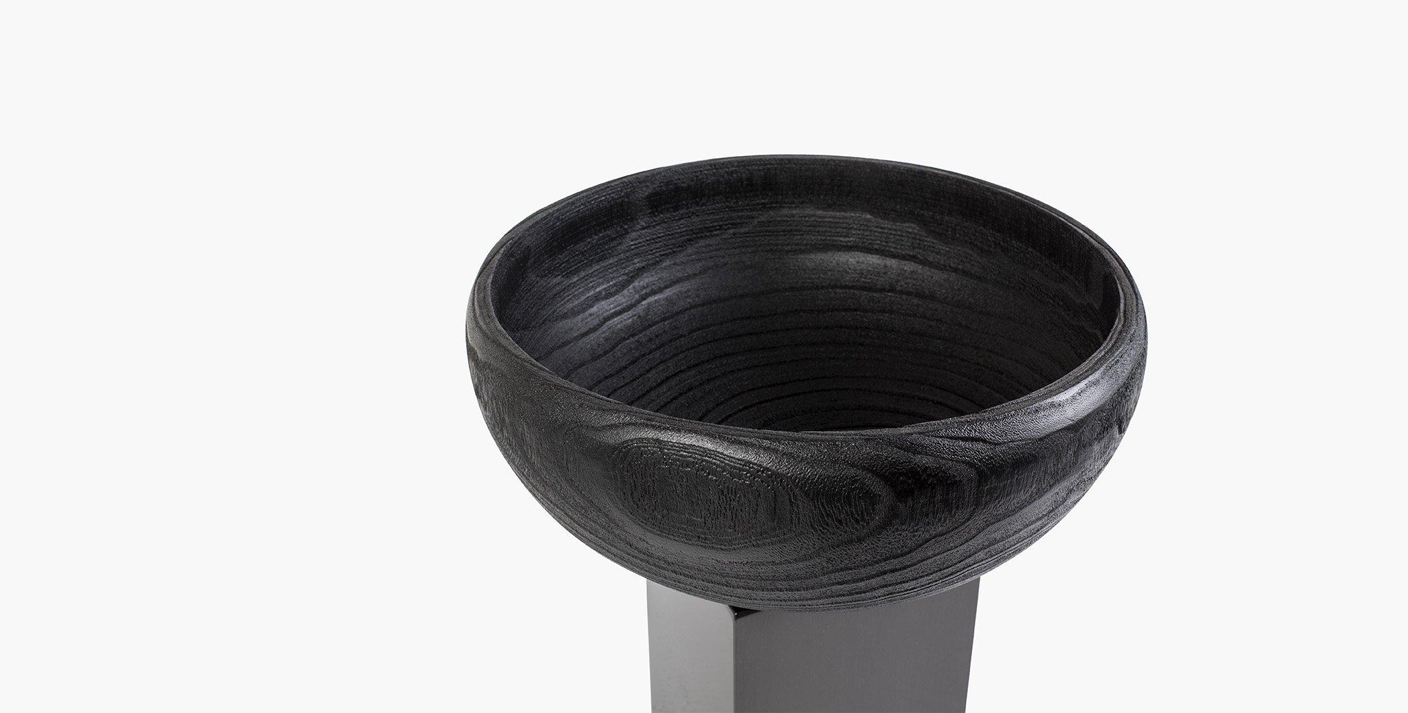 The sculptural Silhouette of our Blackwell vase adds a modern accent to your space. A charcoal finished wood bowl is paired with a blackened steel plinth base. Style alone or add minimal blooms for stunning effect.

Paulowina wood
Charcoal