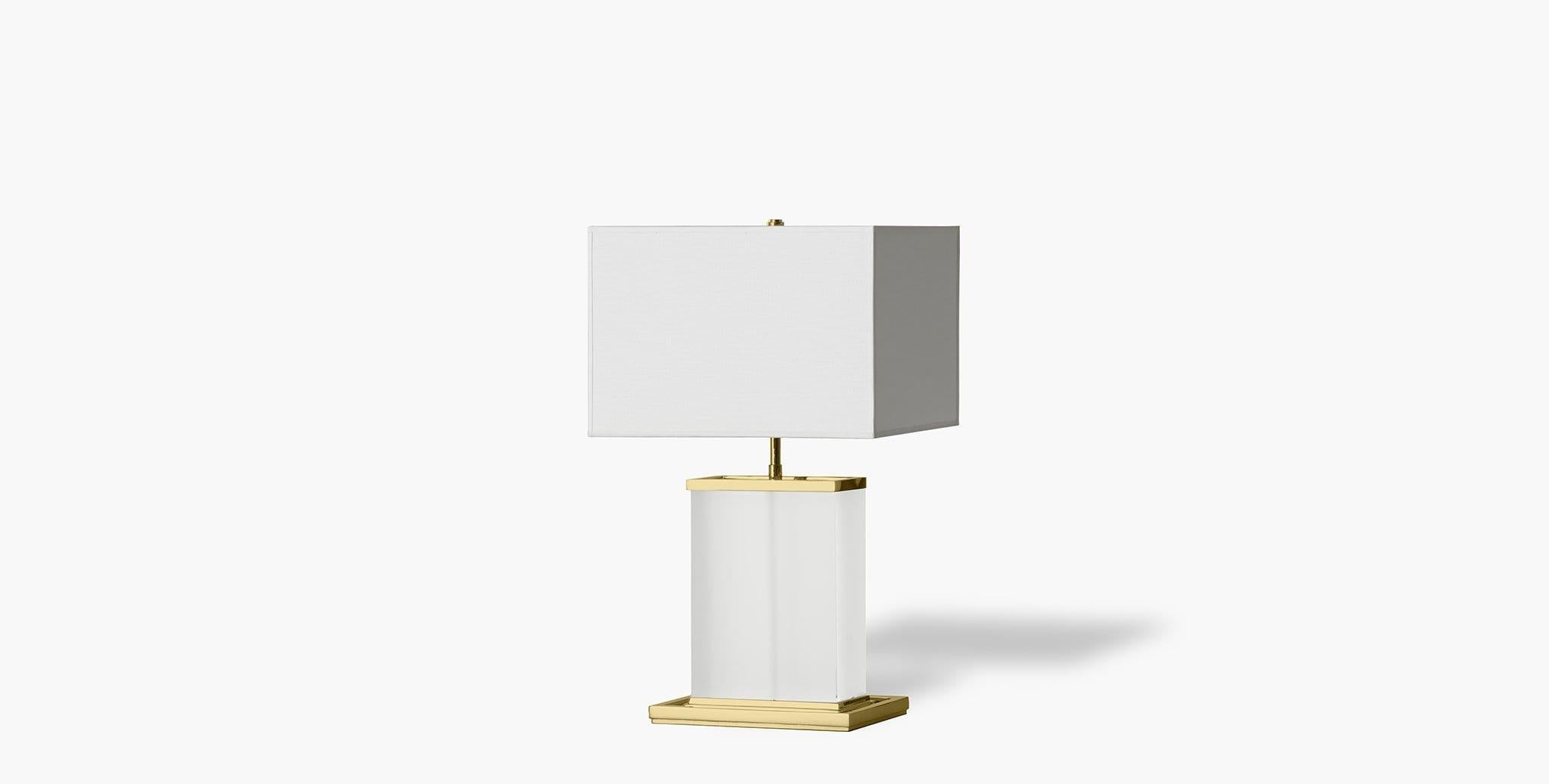 The Brier Table Lamp radiates a soft, luminous glow that is balanced by the tones of its shade and base. Our handcrafted fabrics, leathers, and finishes are inspired by the natural variations within fibers, textures, and weaves. Each selection is
