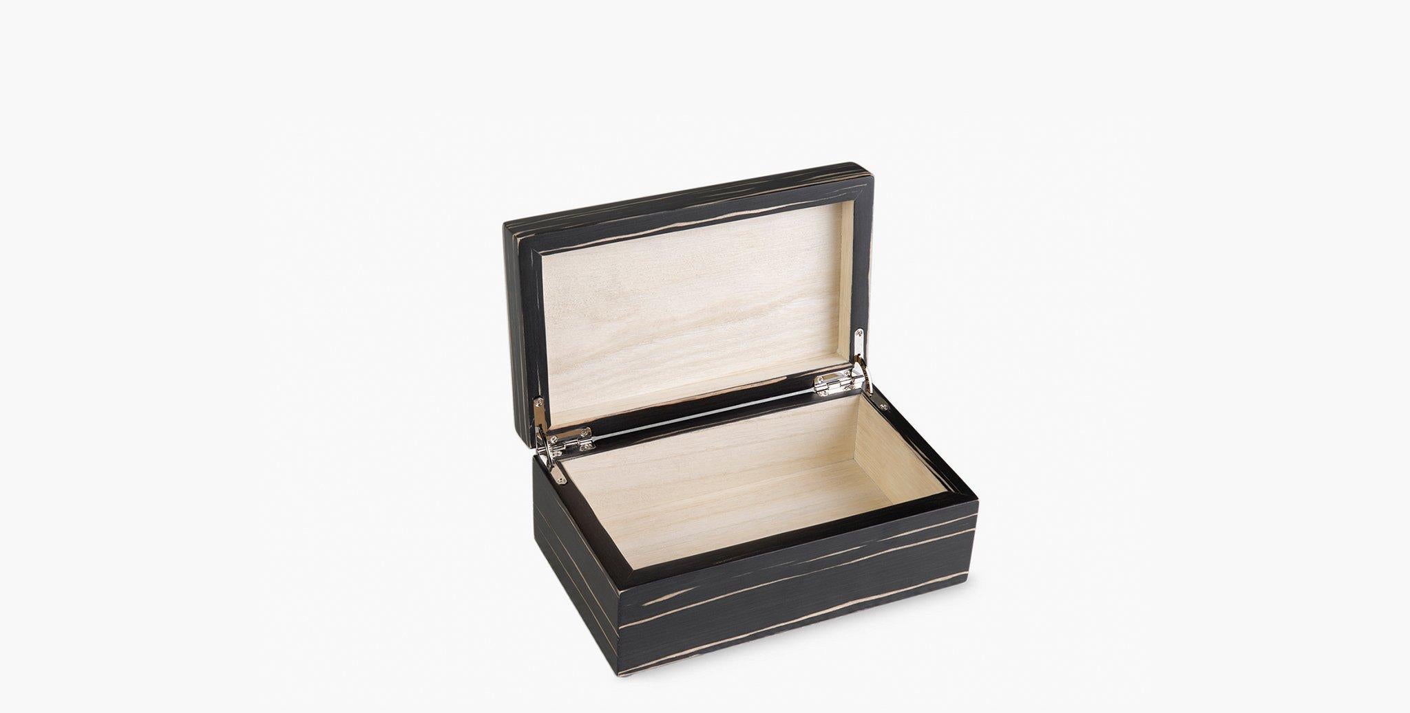 Our semi-luster Brindle Boxes lacquer hinged Paulownia wood boxes offer an elegant organizational option. Our signature striated flame veneer adds a hit of subtle pattern to your room. Available in 2 sizes, perfect for stacking.

Paulownia wooden