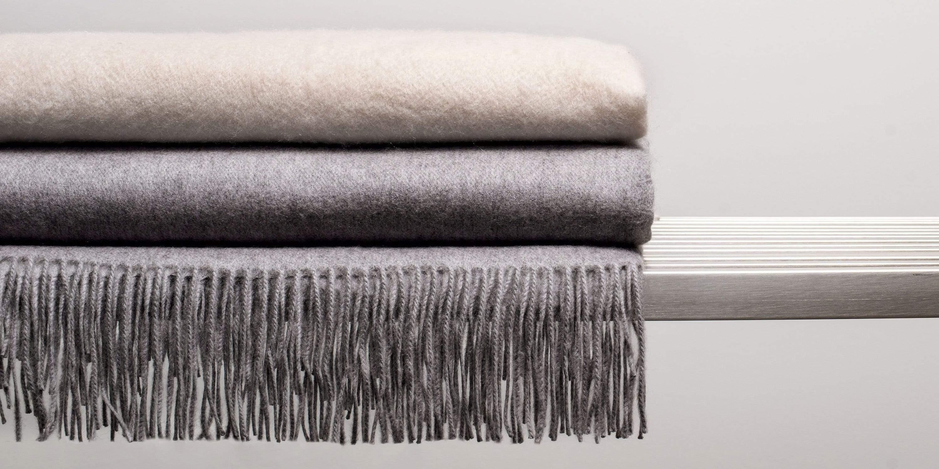 Our interpretation of the classic cashmere throw. We use only the finest 550-gram cashmere yarns, chosen expressly for their extraordinary softness. Soothing neutral tones with twisted fringe-edging make this the perfect finishing touch to your