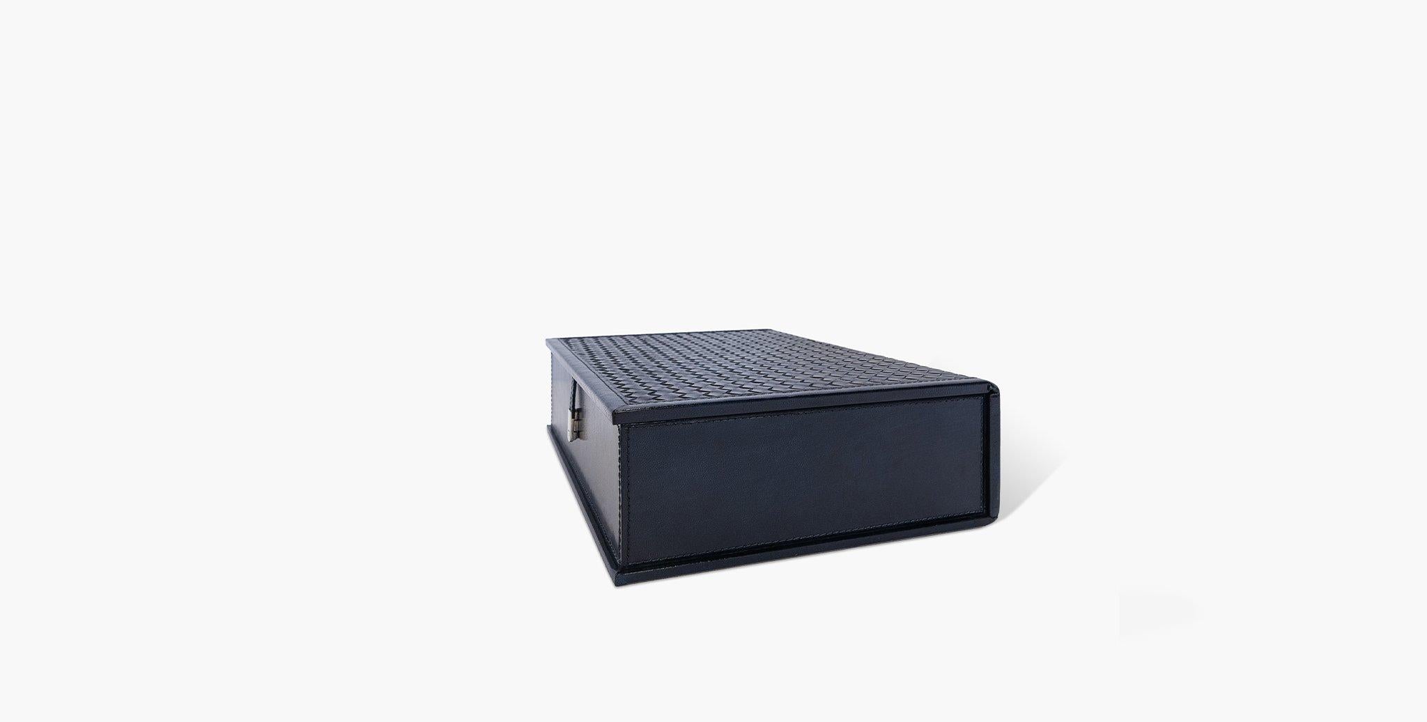The Clarion Document Box features a sleek profile and textured leather exterior to store your loose documents. 

Basketweave leather design
Suede interior 
Polished magnetic metal lock closure
Imported