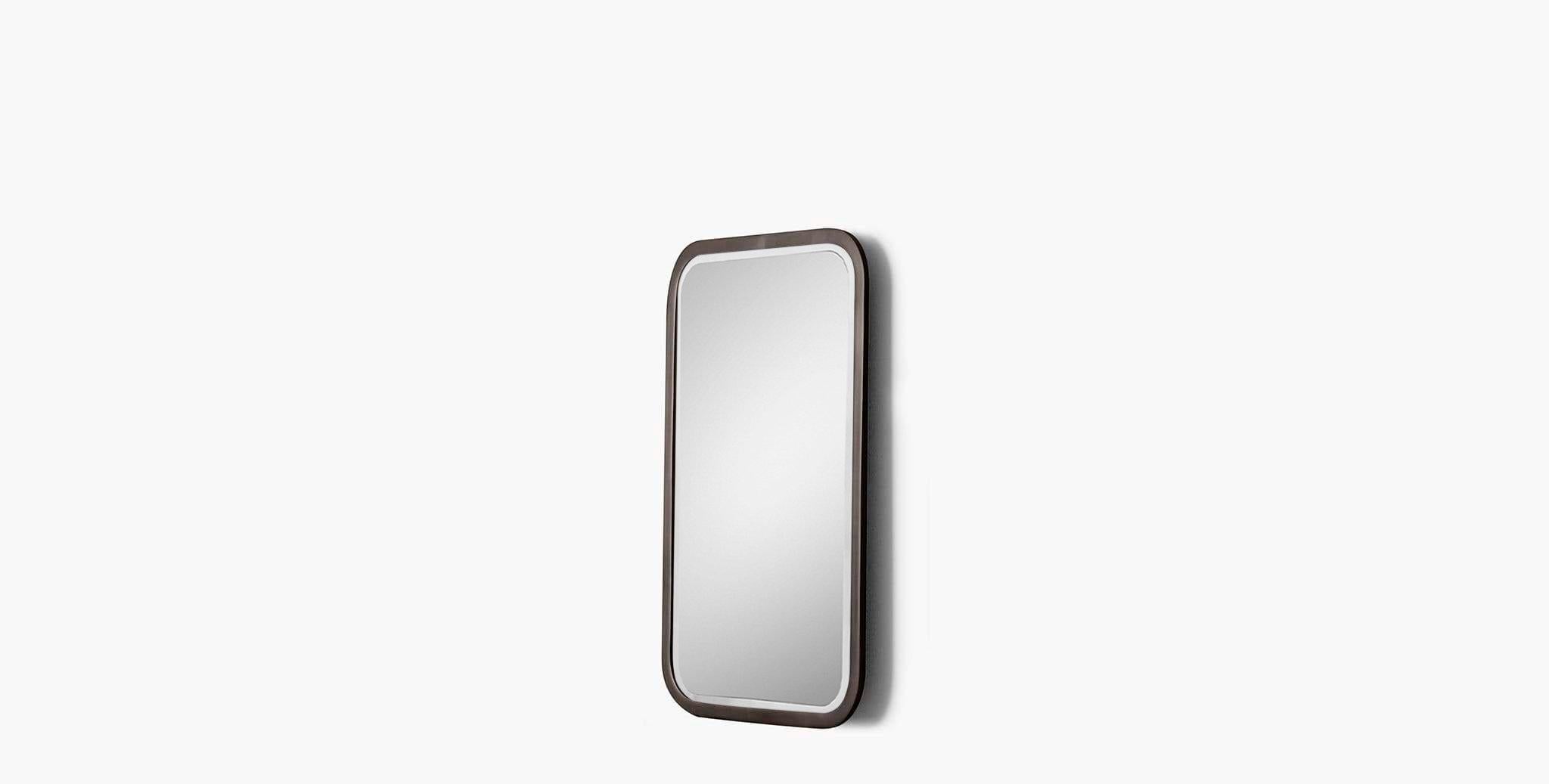 Our Fenne Wall Mirror has a rounded rectangle form outlined in a metallic frame, providing a refreshing curved element to your space that is refined and modern. Our handcrafted finishes are inspired by variations within natural textures. Each