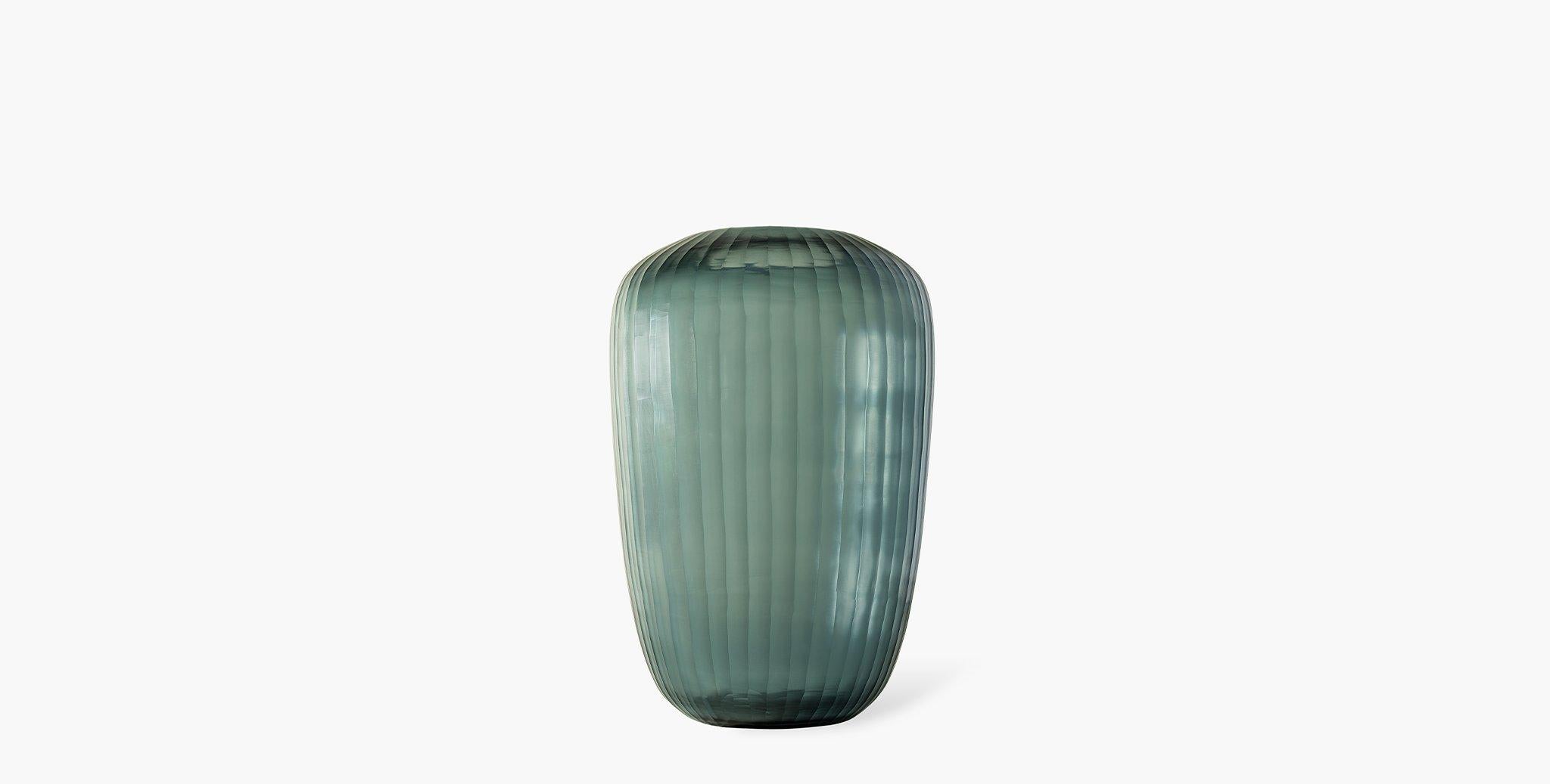 Our Grove Glass Vases feature a beautiful translucent matte indigo color that is reminiscent of sea glass.

Glass
Imported