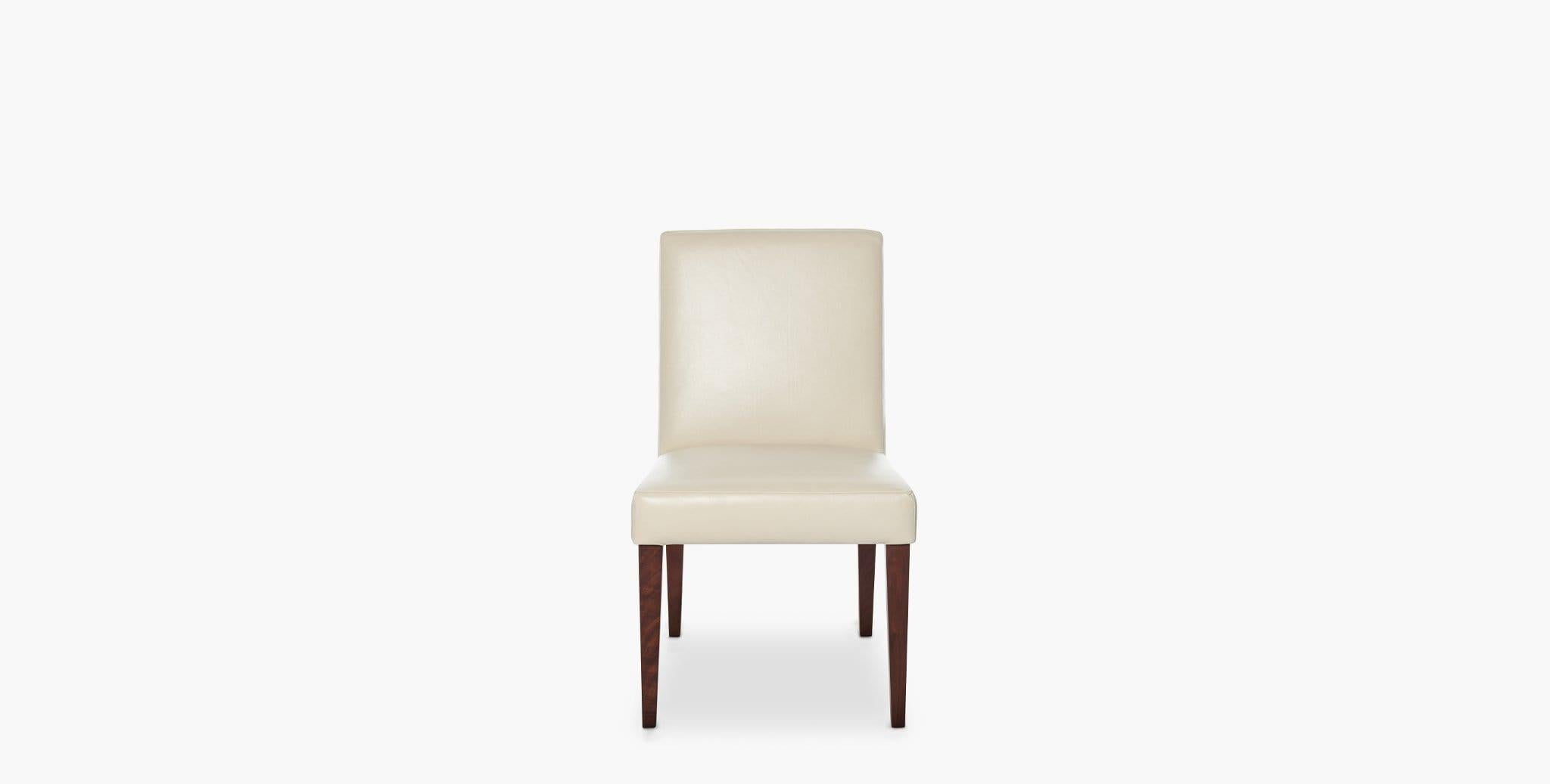 Our Hadley Dining Chair features a simple Silhouette coupled with an upholstered padded seat and back, making it the perfect addition for dining, desk or vanity seating. Our handcrafted fabrics, leathers, and finishes are inspired by the natural