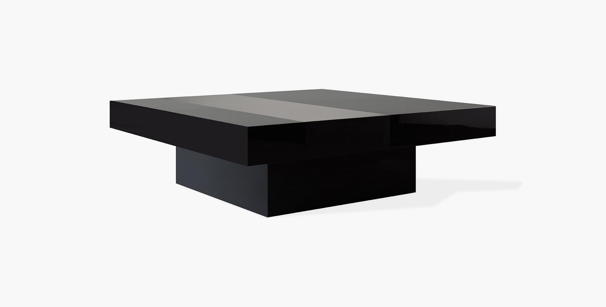 The plinth base square silhouette of the Hawke coffee table combines both a minimalistic form with riveting features such as high sheen lacquer and a brass inlay detail with Verde finish.
 