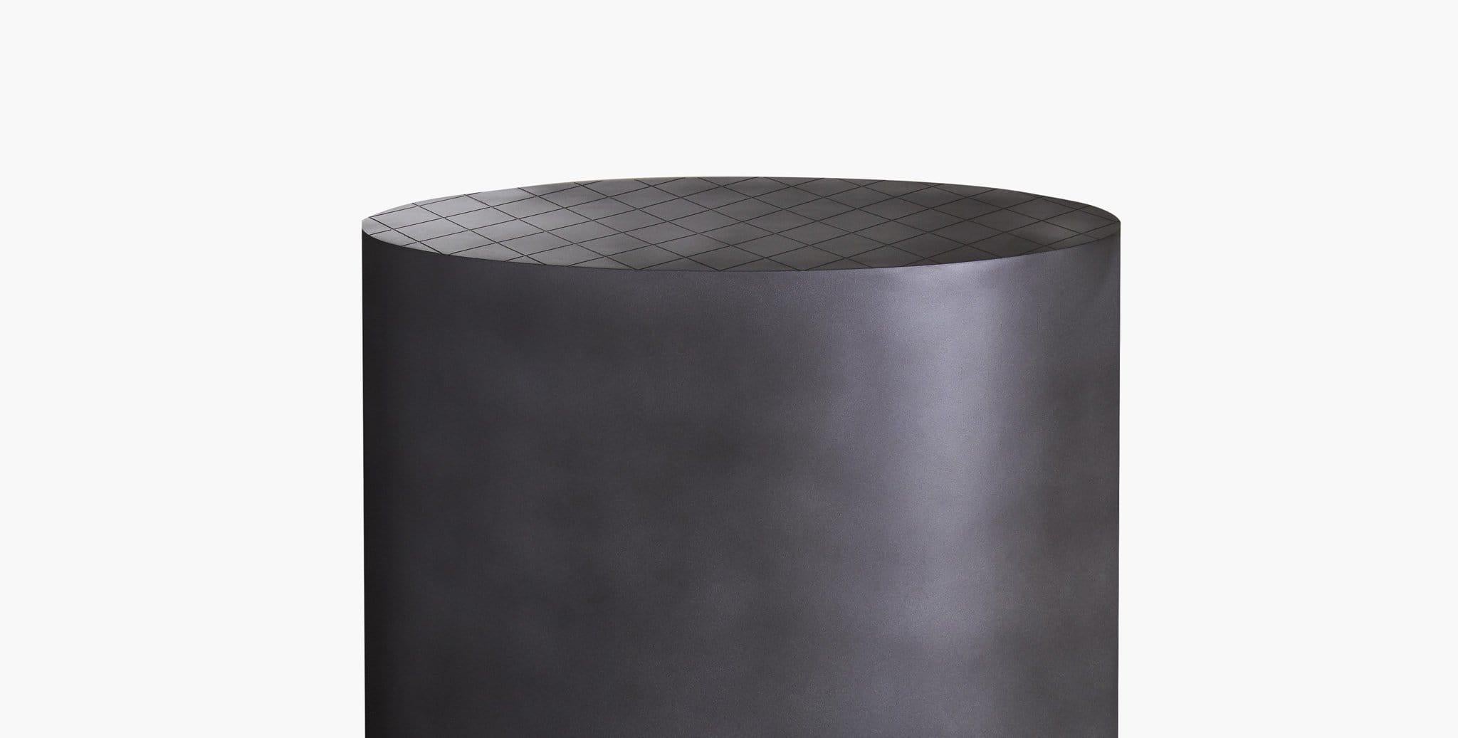 Our Isla Side Table has a unique oval shape featuring an antique zinc finish and is topped with an etched grid pattern. Our handcrafted finishes are inspired by variations within natural textures. Each selection is slightly unique.

Drum