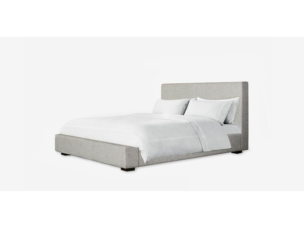 The richly upholstered Loma bed offers a low profile silhouette for your bedroom, with clean linear lines offering a minimal, elegant vignette. Size: King. Upholstered with performance refined heather fabric.
   