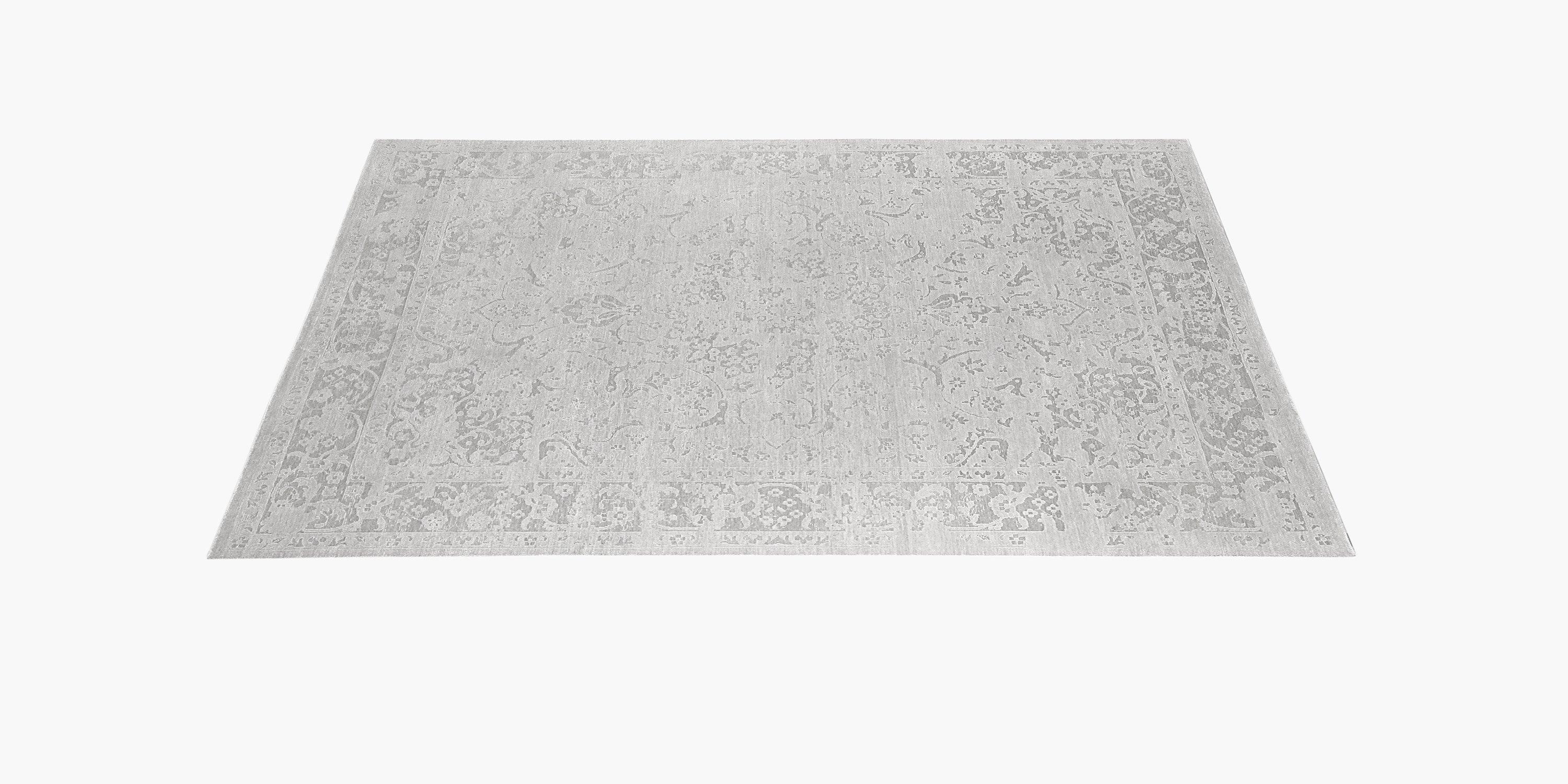 A fractured floral motif seems to fade in and out of our rug, modernizing an antique design. Lyo is hand-knotted by master artisans from extremely fine New Zealand wool yarns and silky fibers, creating a beautifully soft hand and a lustrous sheen.