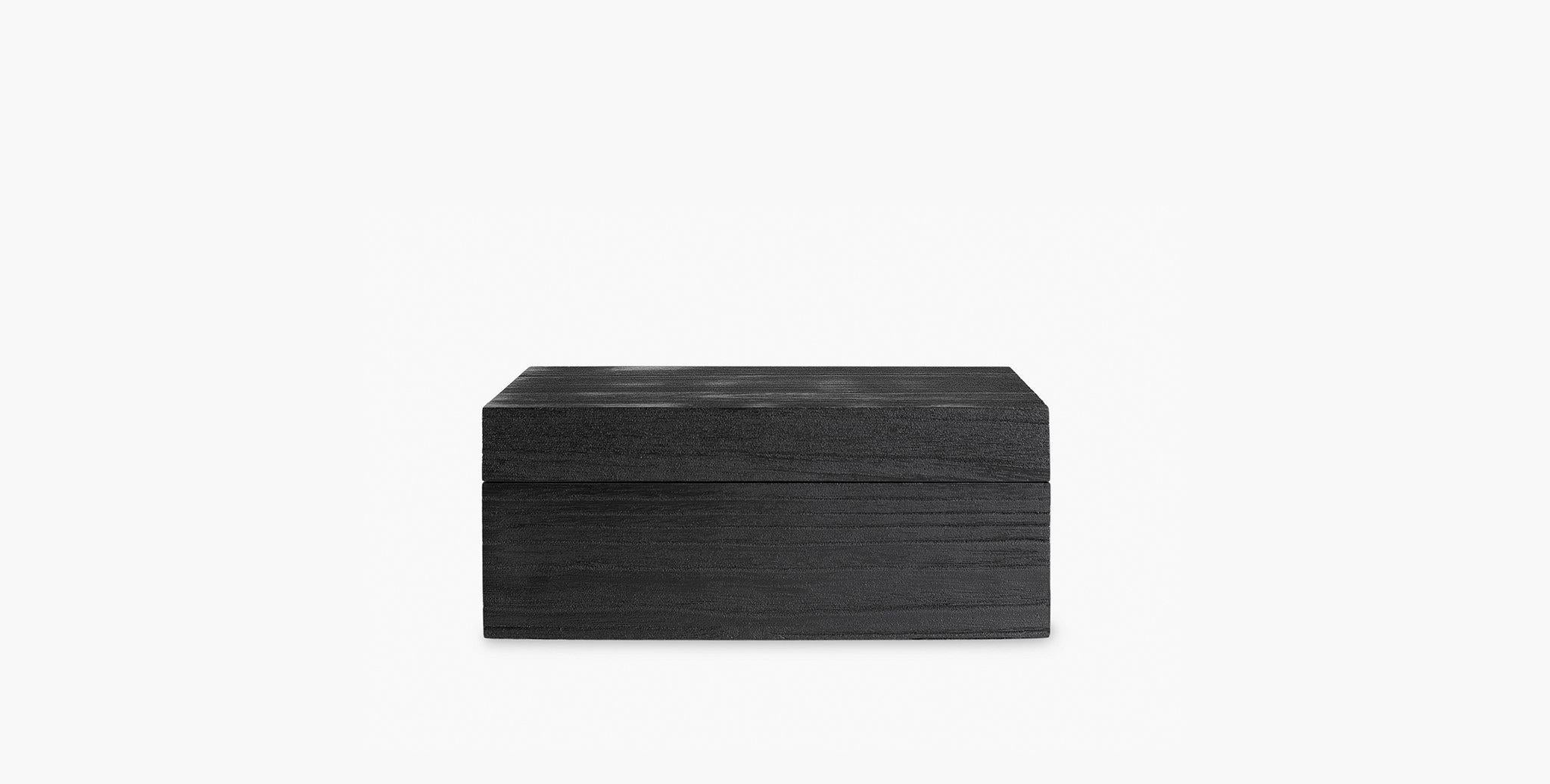 Our Monteserrat Paulowania hinged decorative boxes, are washed in a deep charcoal stain which allows the grain to be prominently highlighted, adding a subtle textural interest to your vignette. A sophisticated organizational option.

Available in 2
