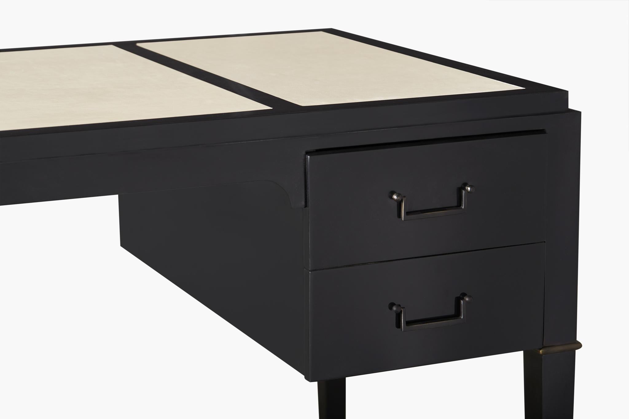 The Northwood desk brings a Classic simplicity to a room. A high polish ebony finish, inlaid leather blotter top and simple black metal pulls come together to create an exceptional handsome piece.
   