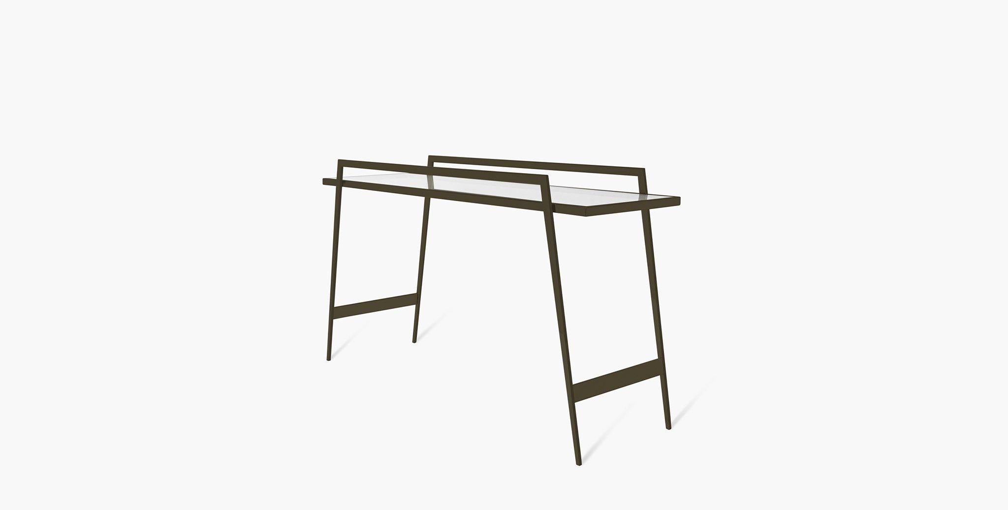 The Palisade Console Table glimmers with metal and the sheen of glass, inviting light into your space. Two elevated rails provide a definitive border for your tabletop display.

Dual elevated rails
Clear glass tabletop
Tapered legs
Steel