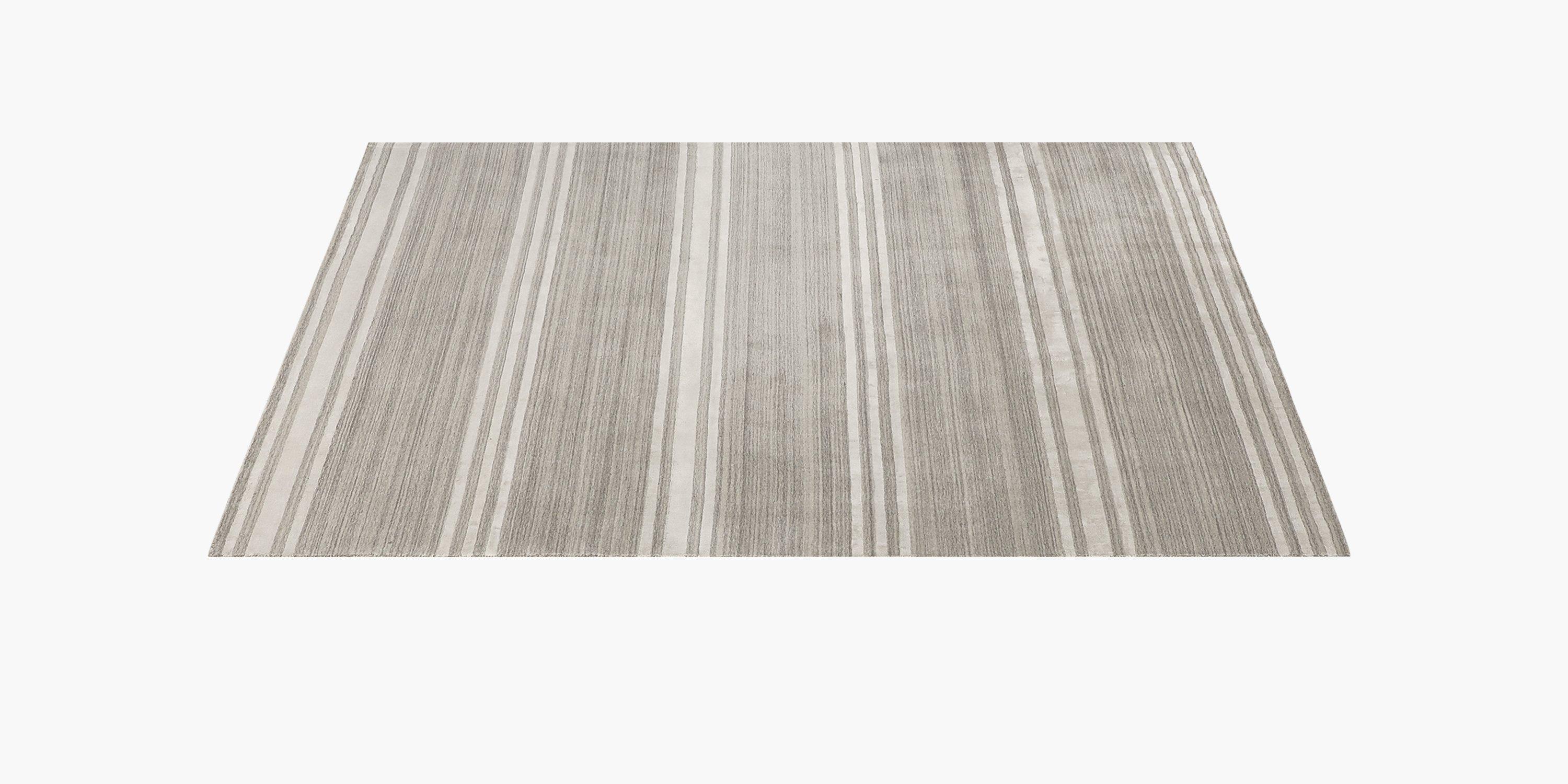 Luxuriously soft and handsomely patterned, our rug offers plushness and a hint of shine. Handwoven from varying lengths of soft, lustrous New Zealand wool, the Rayado's multi-textural surface adds visual interest to any space. Its natural colors