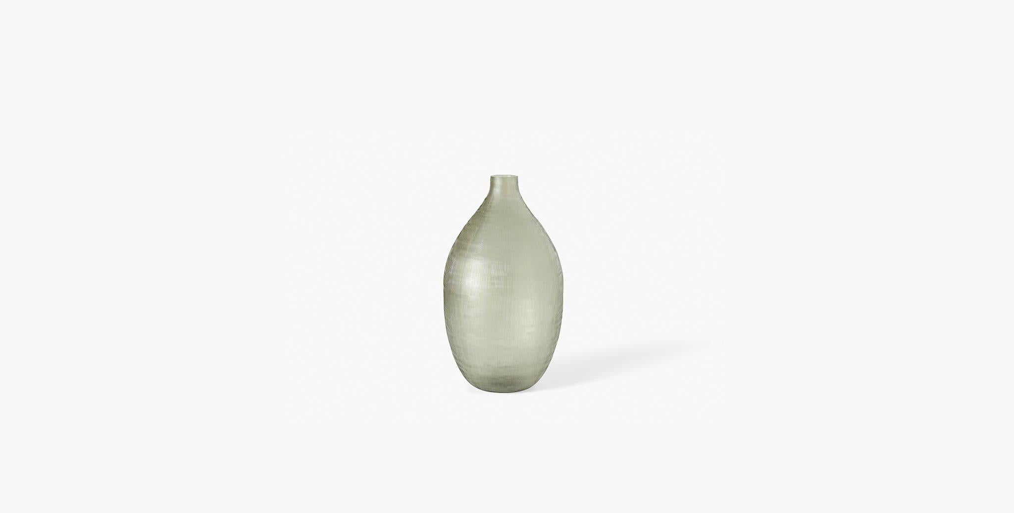 Our Rhea Vessel has a modern semi-opaque glass finish with a subtle crosshatch pattern that creates textural interest to your home design. Our handcrafted fabrics, leathers, and finishes are inspired by the natural variations within fibers,