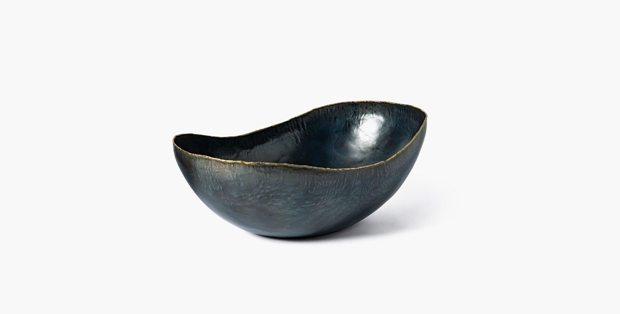 Our Vernon Bowls feature organic curves in ebonized iron with subtle metal detailing to highlight its serpentine edge. Our handcrafted fabrics, leathers, and finishes are inspired by the natural variations within fibers, textures, and weaves. Each