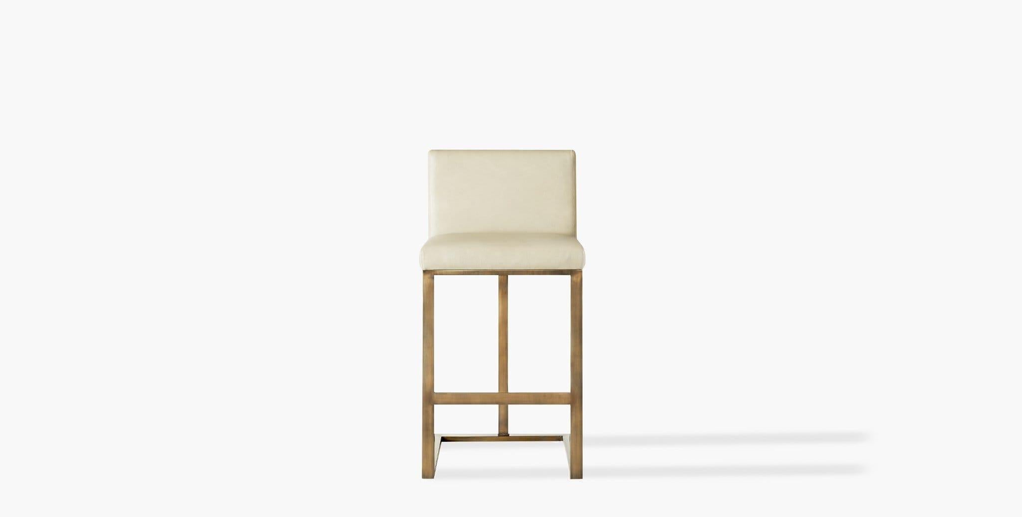 Our Savannah Bar Stool features clean lines, a padded seat, and a silhouette suitable for the most elegant spaces. Our handcrafted fabrics, leathers, and finishes are inspired by the natural variations within fibers, textures, and weaves. Each