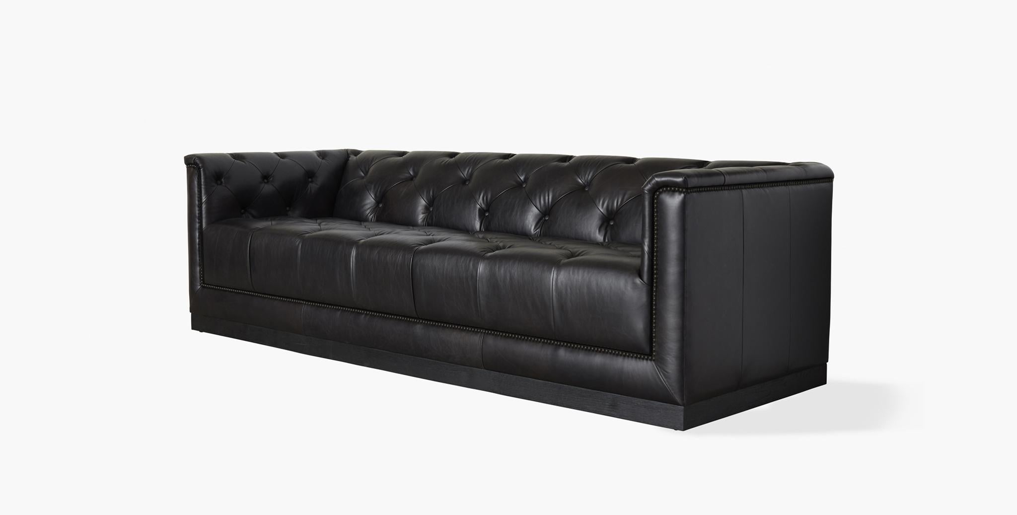 The Woodward is a modern reinterpretation of the iconic chesterfield sofa, upholstered in rich Italian leather, with hand button-tufting, svelte rolled arms, a deep single-cushion and a leather apron front. The Woodward is a statement piece that