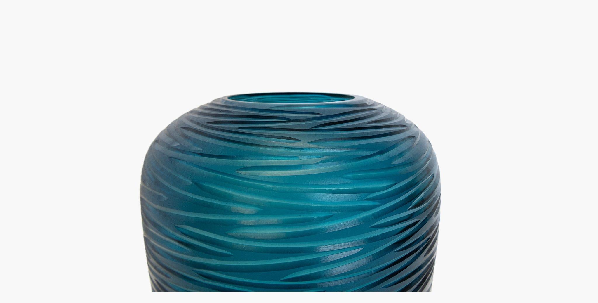 Our Zado vase is handblown by master glass artisans then etched to create the beautiful organic embossed pattern on the vase. A perfect addition to any vignette.

Clay cut
 