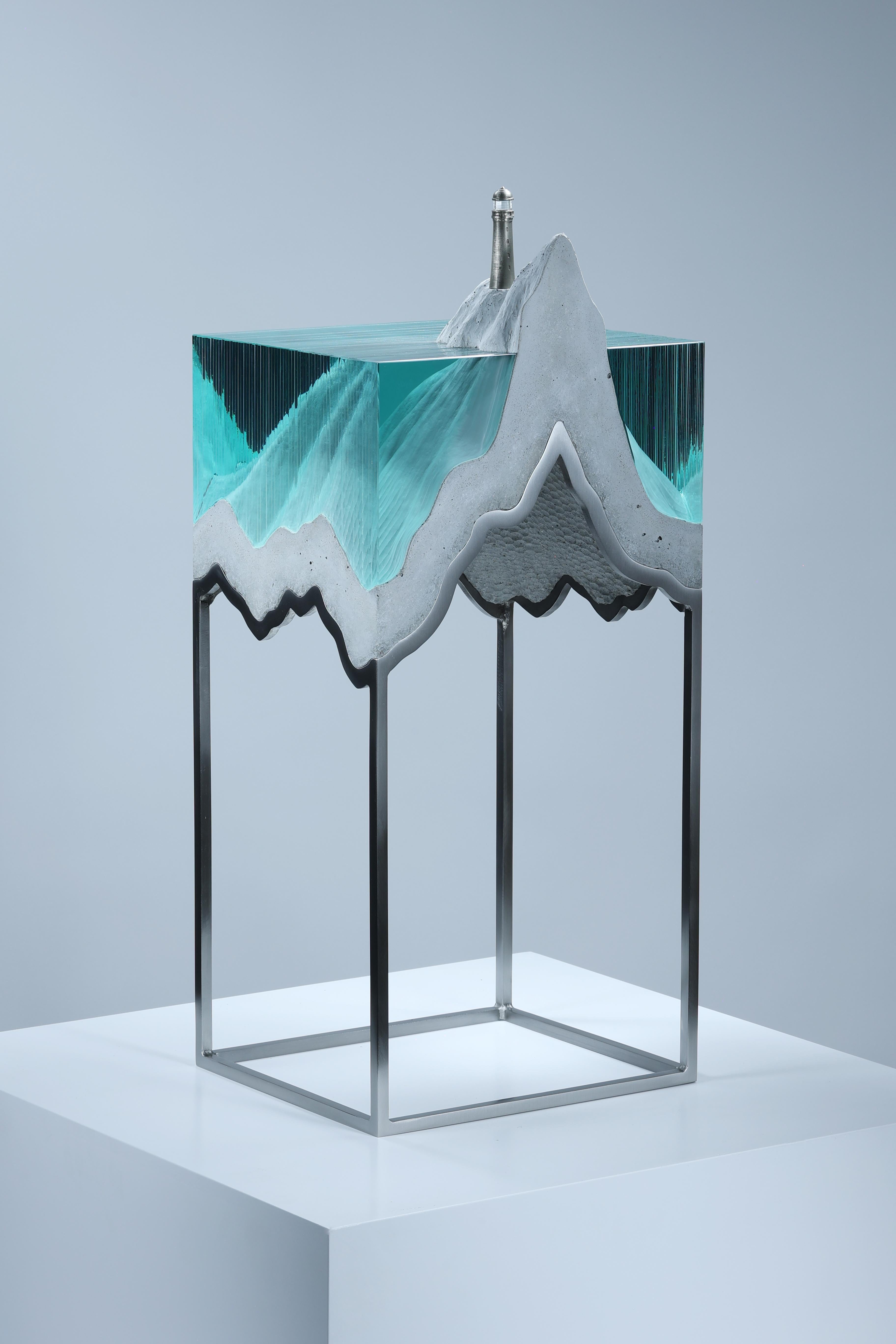 Ben Young’s sculpture fluidly blends glass, concrete, bronze, steel, and light to depict romantic and pensive imagery highlighting the fragility of our climate and its most precious resource – water. Born in Australia and raised in New Zealand,