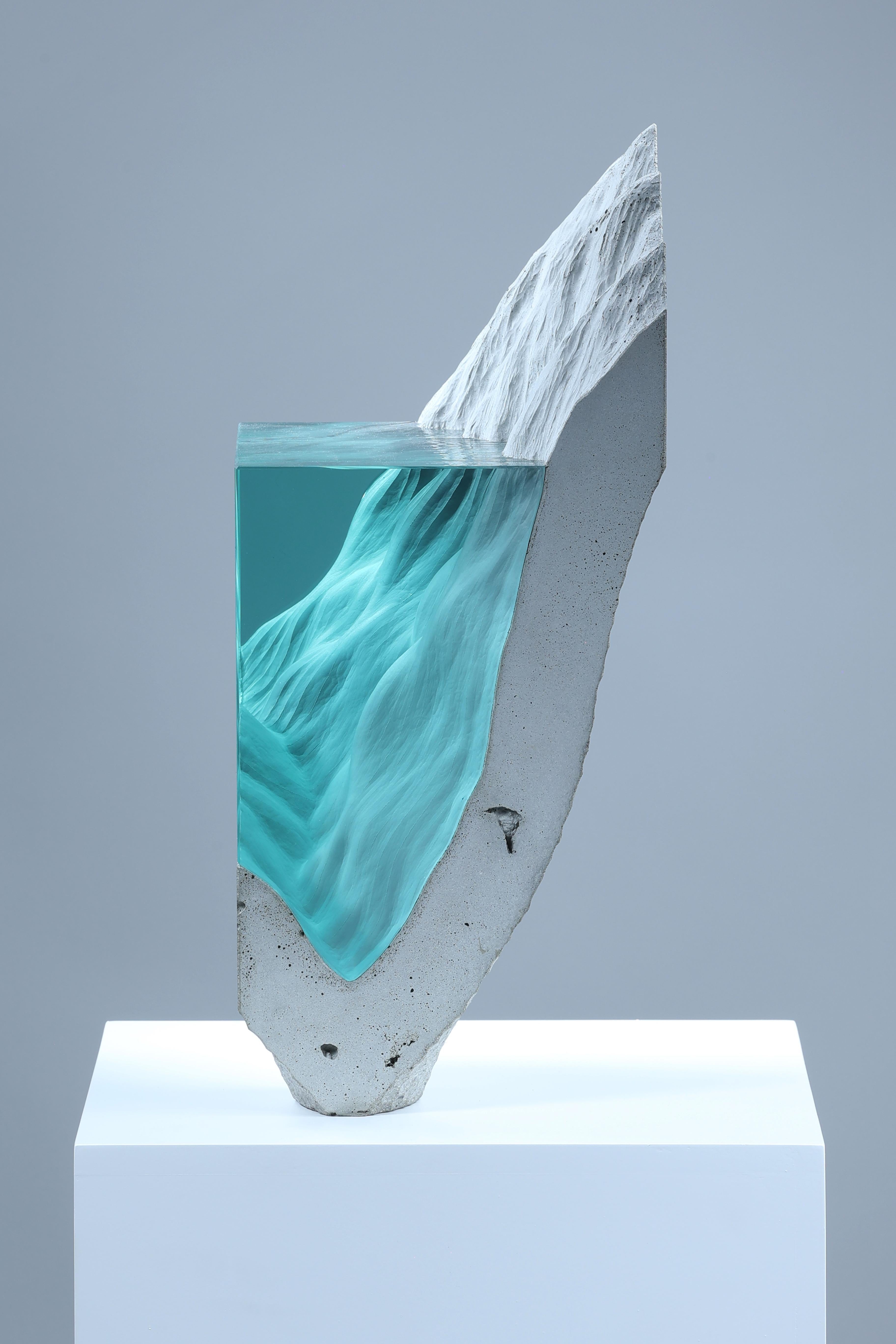 Ben Young’s sculpture fluidly blends glass, concrete, bronze, steel, and light to depict romantic and pensive imagery highlighting the fragility of our climate and its most precious resource – water. Born in Australia and raised in New Zealand,