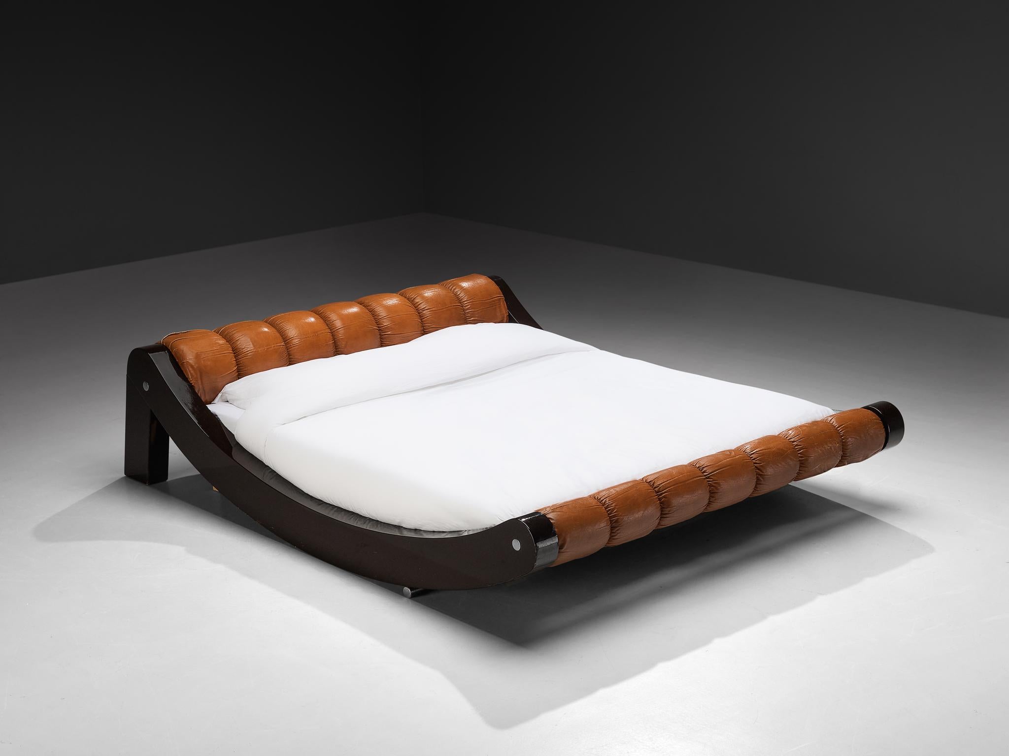 Benatti, 'Boomerang' queen bed, lacquered wood, leather, Italy, 1972

Rare and monumental Italian double bed made in the 1970s. This Boomerang bed is made by Italian manufacturer Benatti and shows all characteristics of design in the post-modern era