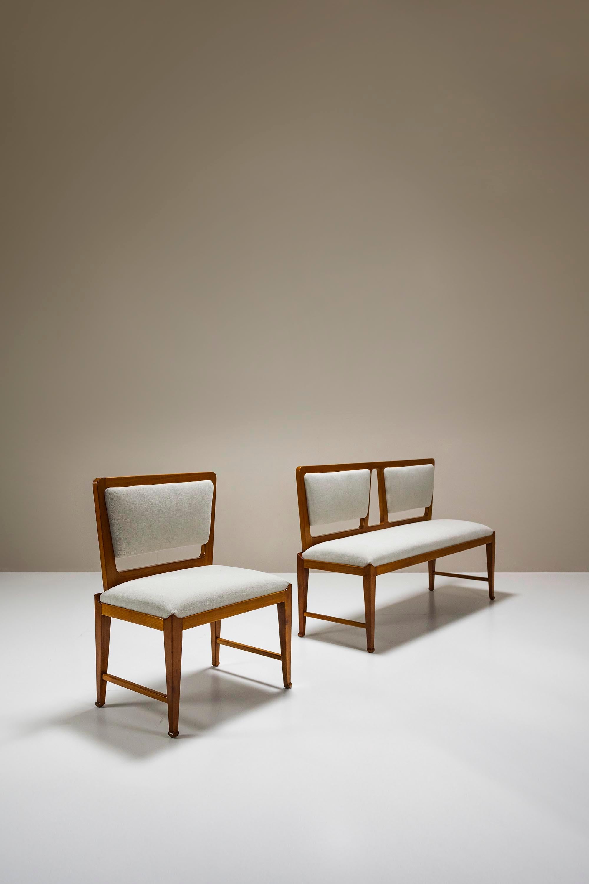 This set consisting of a two-seater bench and matching side chair brings a flair from times long past.

Design
The traditional wood joints and the upwardly curving corners and legs look classic, while the trapezoid backrests feel mid-century.The