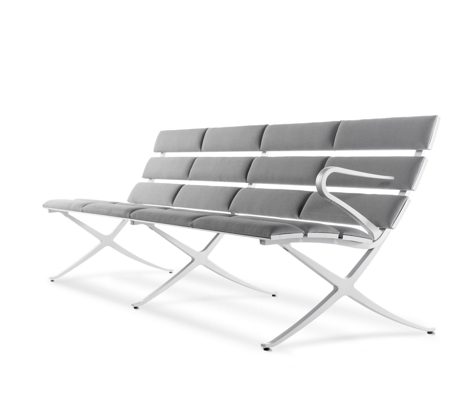 Bench B 4 seater by Konstantin Grcic.
Dimensions: D240 x 70 x H77 cm.
Materials: aluminium, optional upholstery.
Also available in different finishes. 

A bench that is made up of solid extruded aluminium lineal slats and cast aluminium