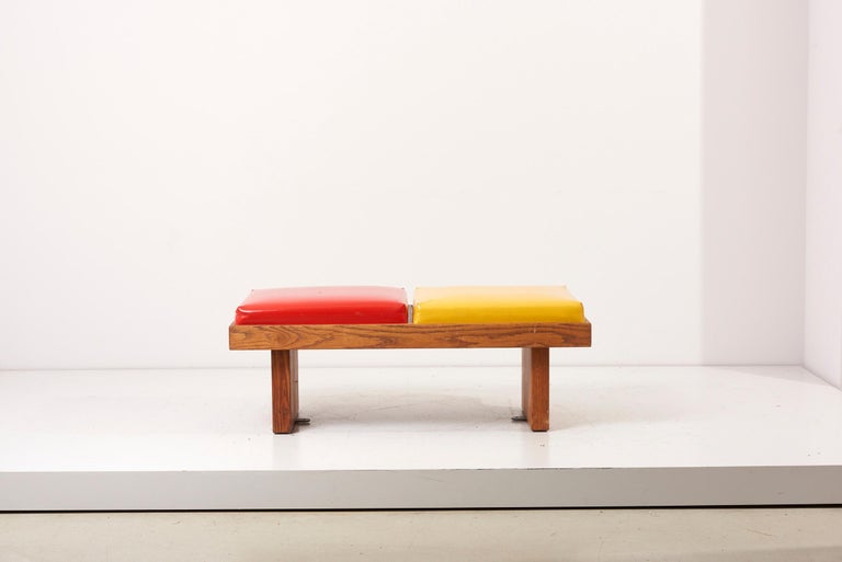 Bench by Harvey Probber in red and yellow with oak base. Excellent original condition.