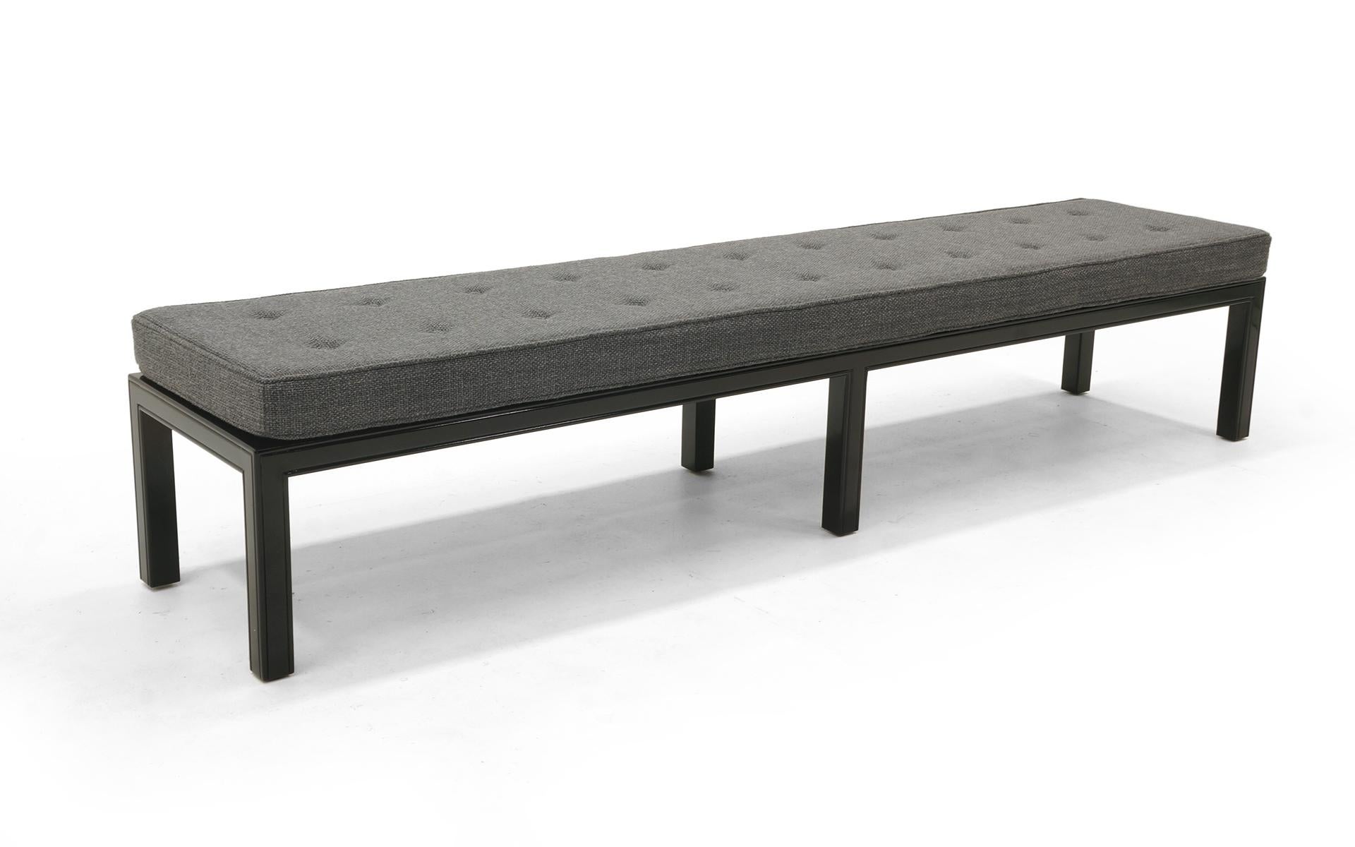 An 84 inch bench by Henredon, 1950s. Completely and expertly restored frames in gloss black conversion varnish (better than lacquer). New cushion with Maharam charcoal grey / medium grey fabric.