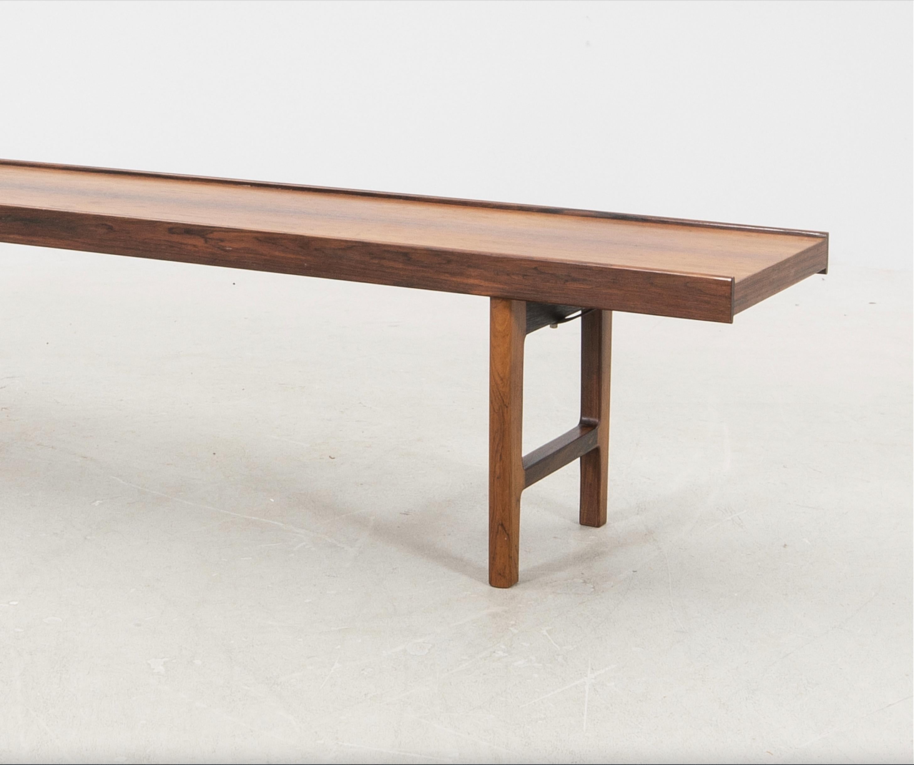 Bench by Torbjørn Afdal Rosewood model “Krobo” for Bruksbo, Norway, 1960s
Introducing a stunning vintage bench by Torjborn Afdal, crafted from luxurious rosewood and featuring his iconic 