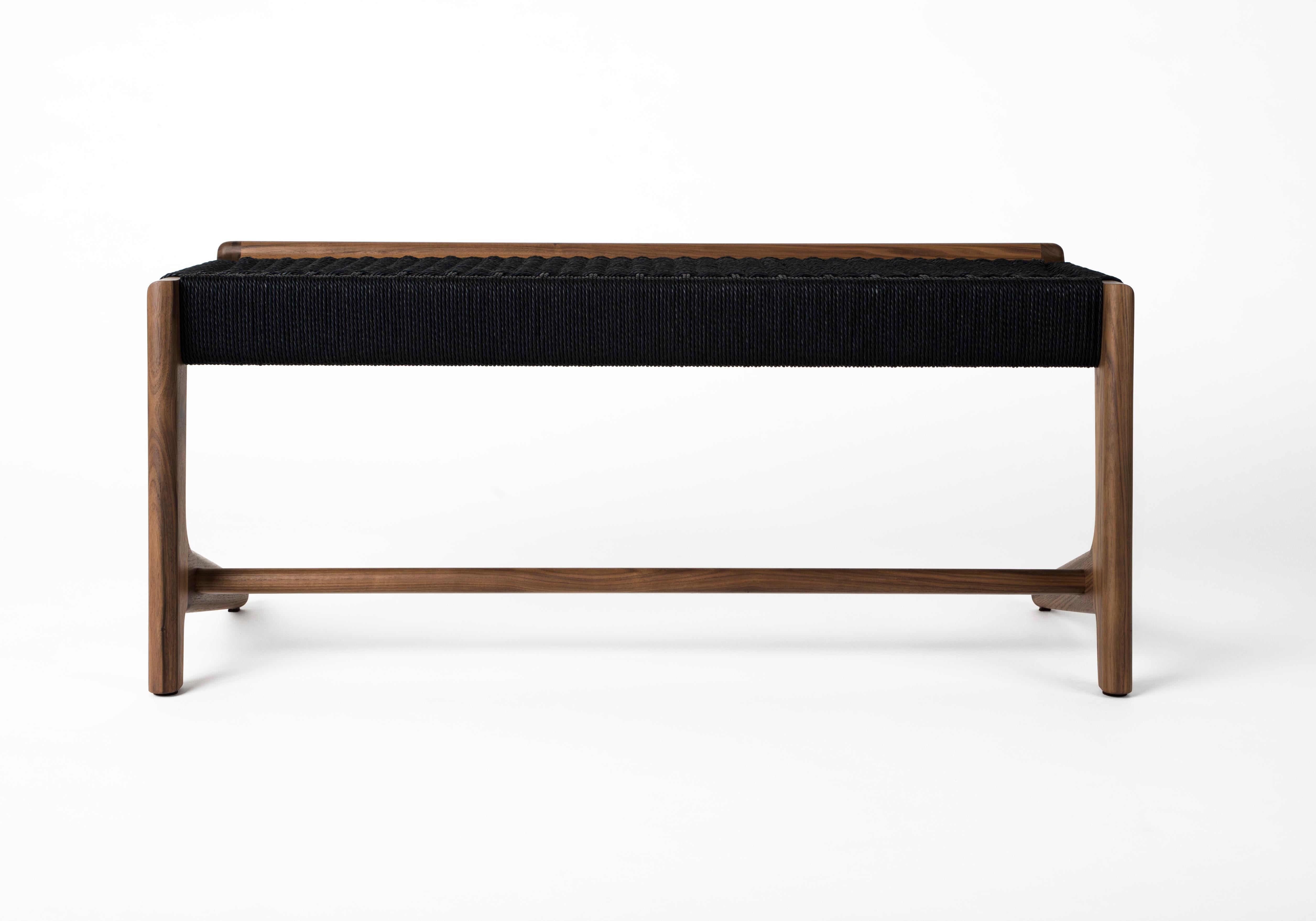 Mid-century inspired Rian Cantilever Bench in Walnut with black danish cord. Custom sizes available. Can be made with any domestic or exotic hardwood of your choosing. Danish cord comes in three colors: Kraft, White and Black. The Danish cord has