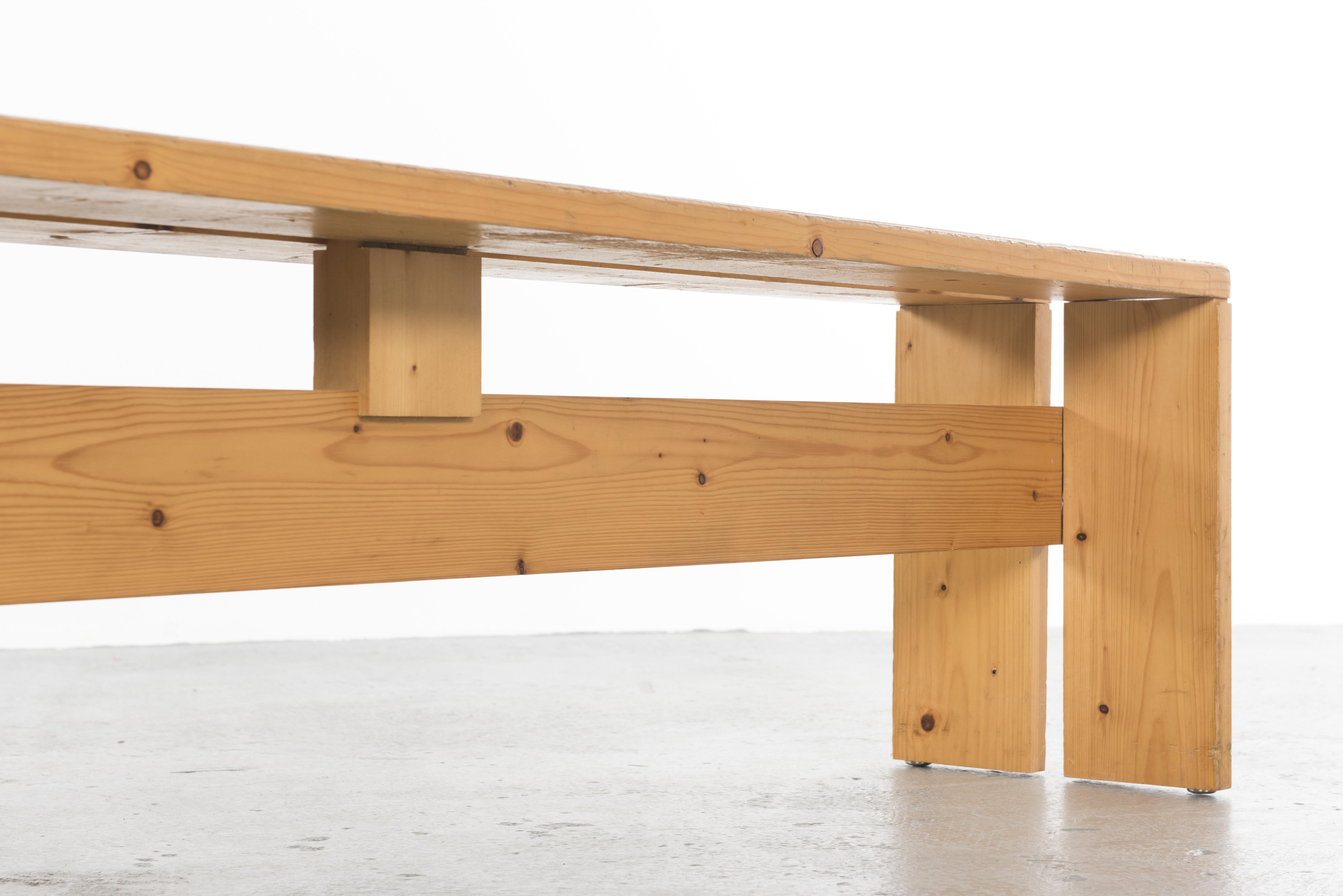 Large bench by Charlotte Perriand in pine wood from the Ski Resort Les Arcs, 1800.
Sleek design in pine in reference to her Minimalist period.

Charlotte Perriand is a French architect and designer, famous for its sober furniture directly