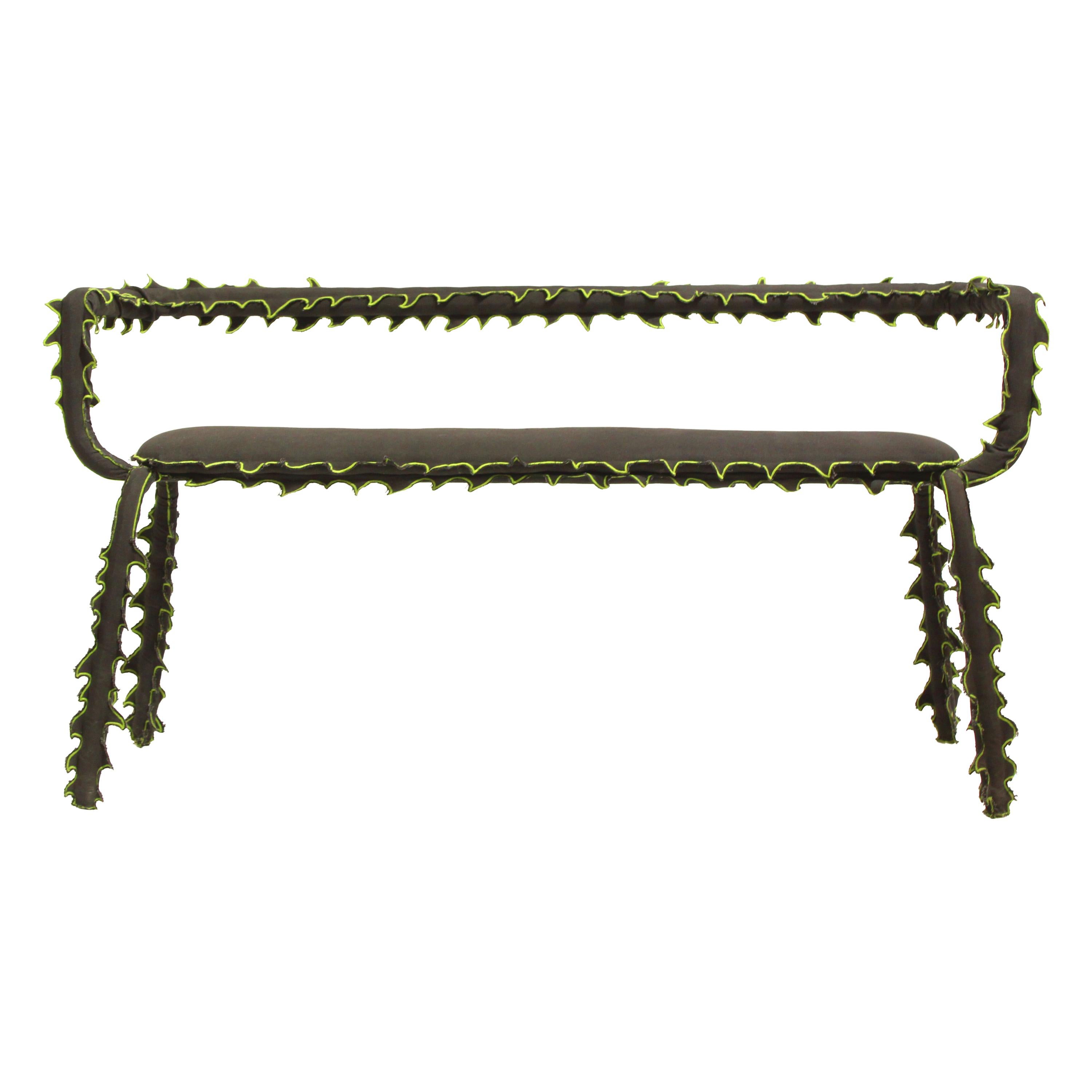 The Disguise Series 00 bench, created by Madrid-based ESTO Studio, is conceived as a sculptural piece that blurs the boundaries between furniture and fiction.

Featuring a curved tubular steel structure and a hand-sewn textile covering, each piece