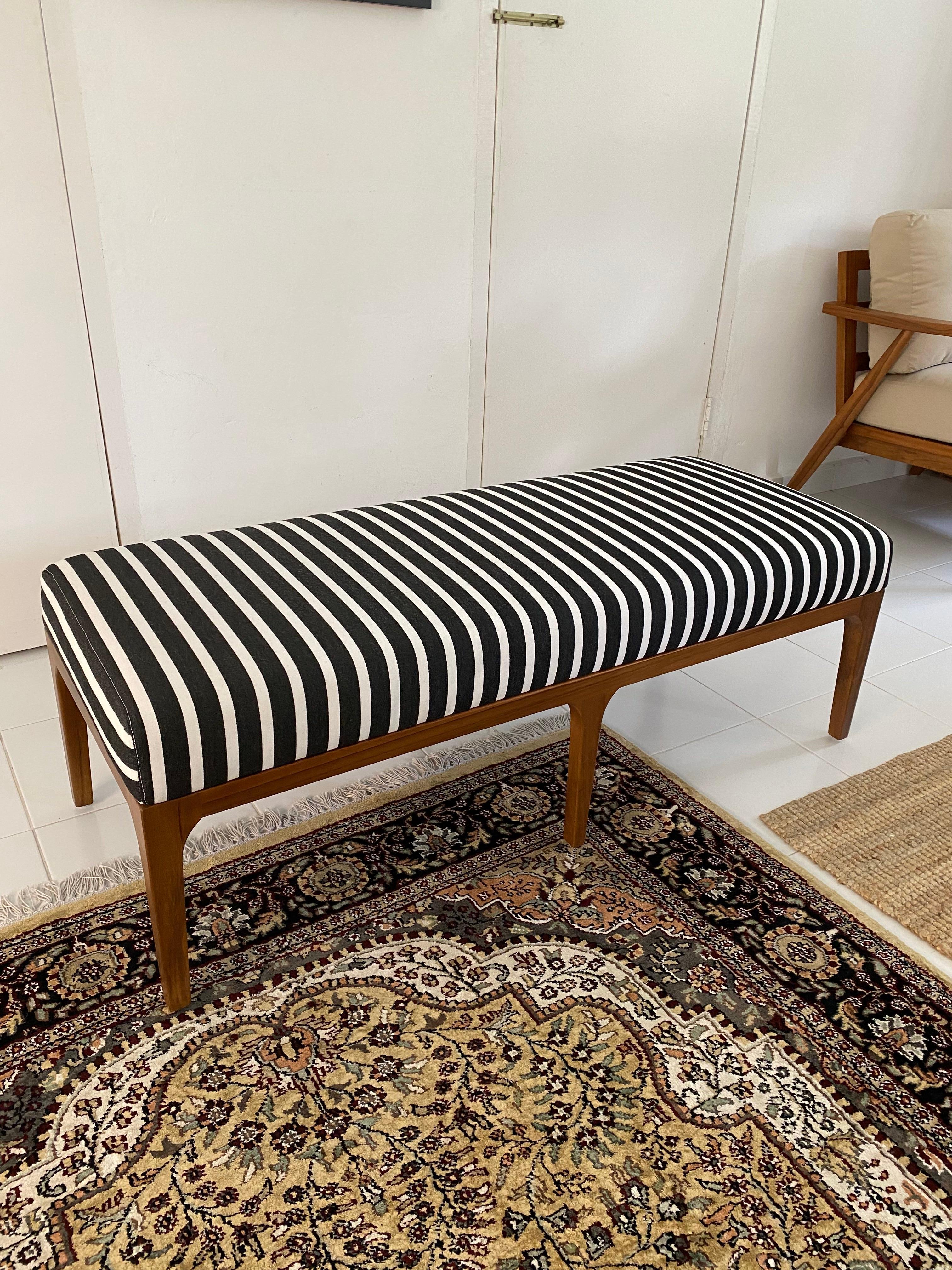This mid-century style bench is made of premium, sustainably sourced teak and is an essential furniture item for your home. Place it at the end of your bed for an elegant addition to your bedroom space, or put in in the living room or dining room