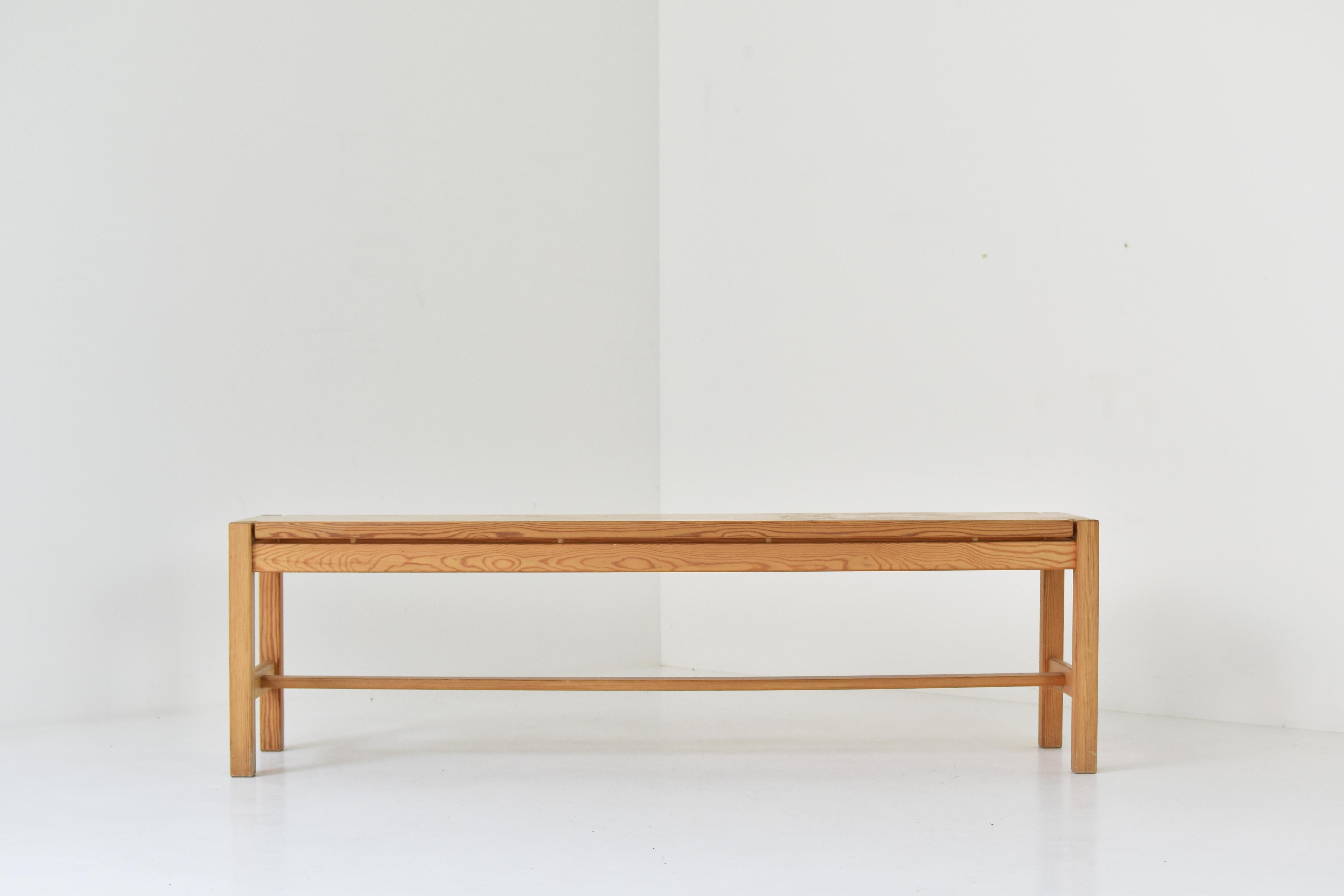 Bench by Ilmari Tapiovaara for Laukaan Puu, Finland 1963. This bench or side table is made out of solid pine and has a very nice warm patina. Elegant and simplistic design. In good condition with some light age related usermarks.