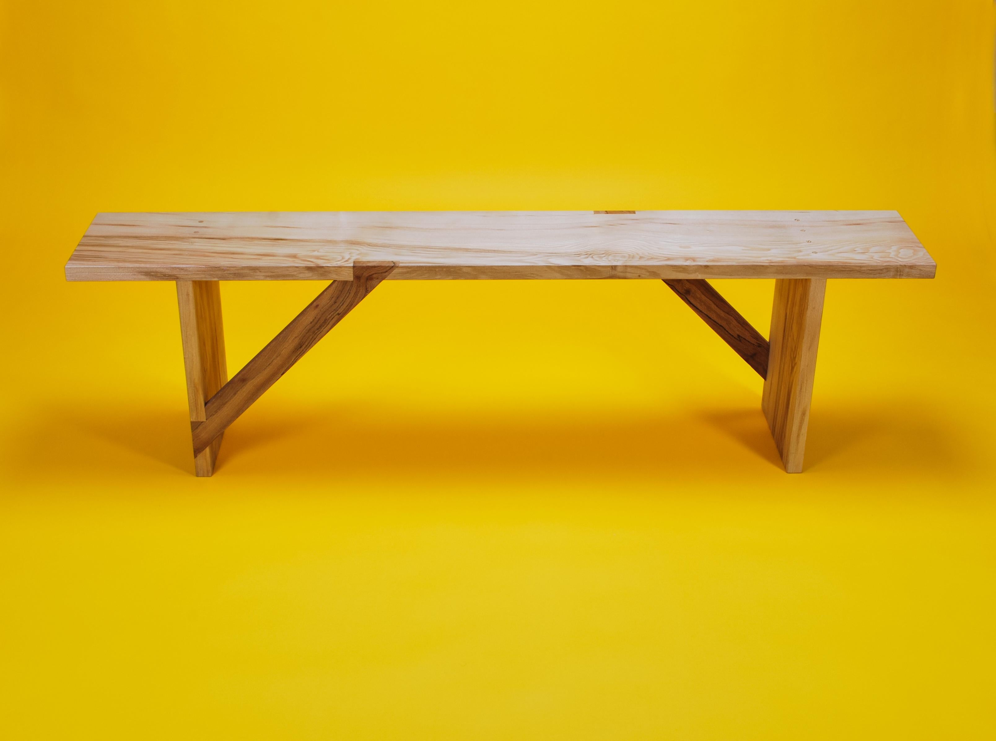 Bench in Solid English Ash and London Plane wood, designed by Loose Fit. Seats three people.

Both versatile and functional, this bench made from a light coloured English Ash, contrasts beautifully with rich brown London Plane braces.

The design of