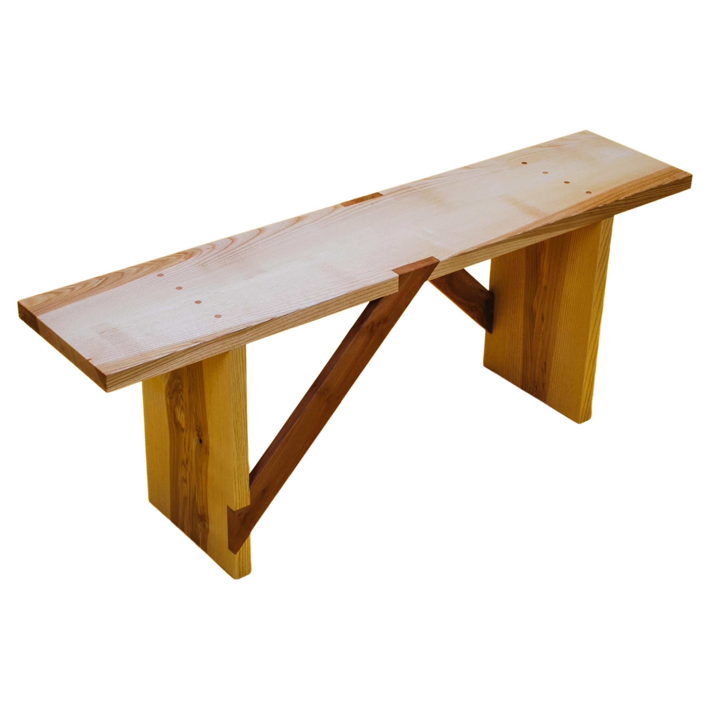 Bench in Solid English Ash and London Plane, designed and handmade by Loose Fit.

Both versatile and functional, this wooden bench is made from a light coloured English Ash that contrasts beautifully with rich brown London Plane braces.

The design