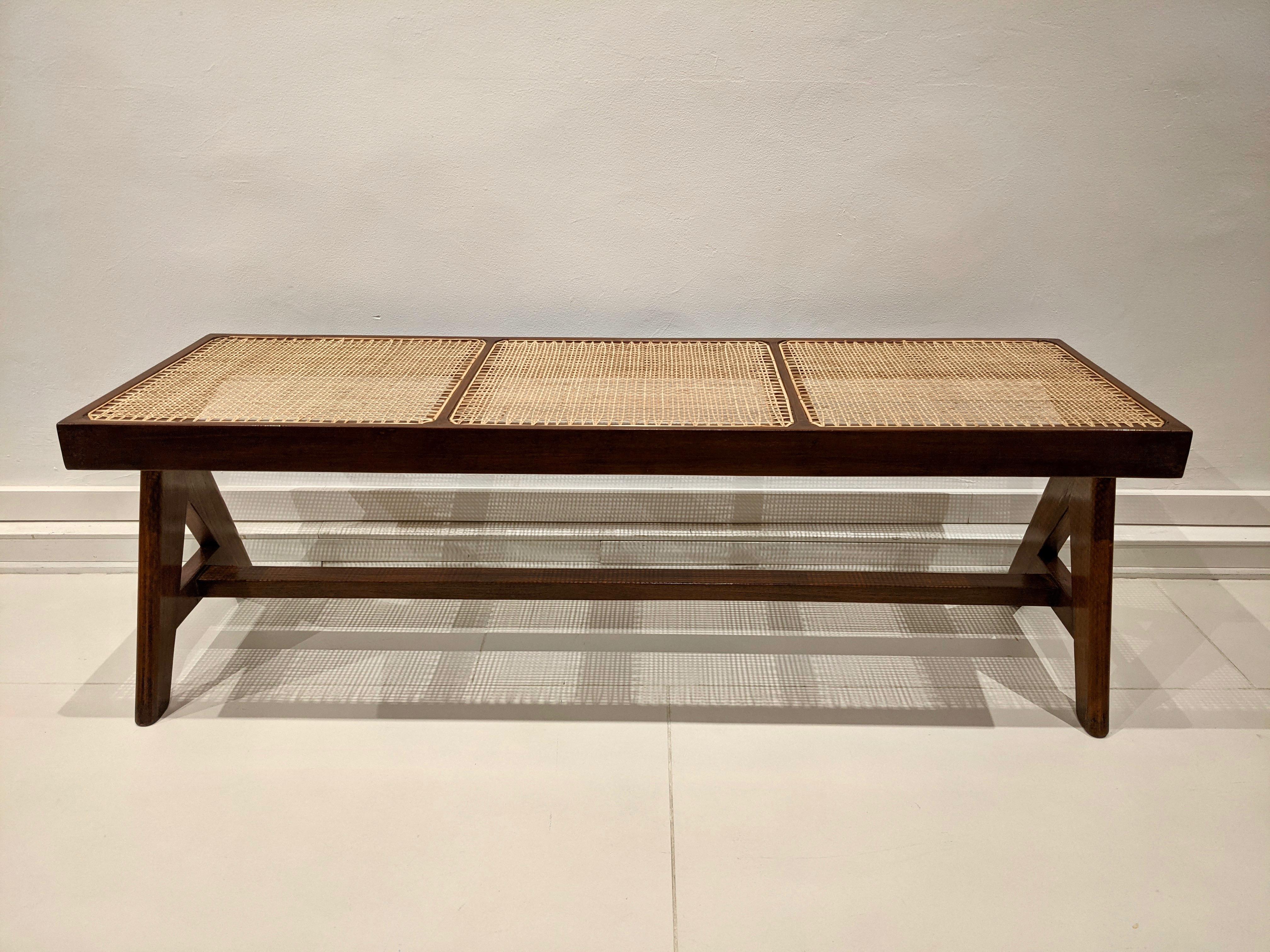 Bench in solid teak and cane by Pierre Jeanneret. Very good condition. Restoration of the wood. Circa 1956.