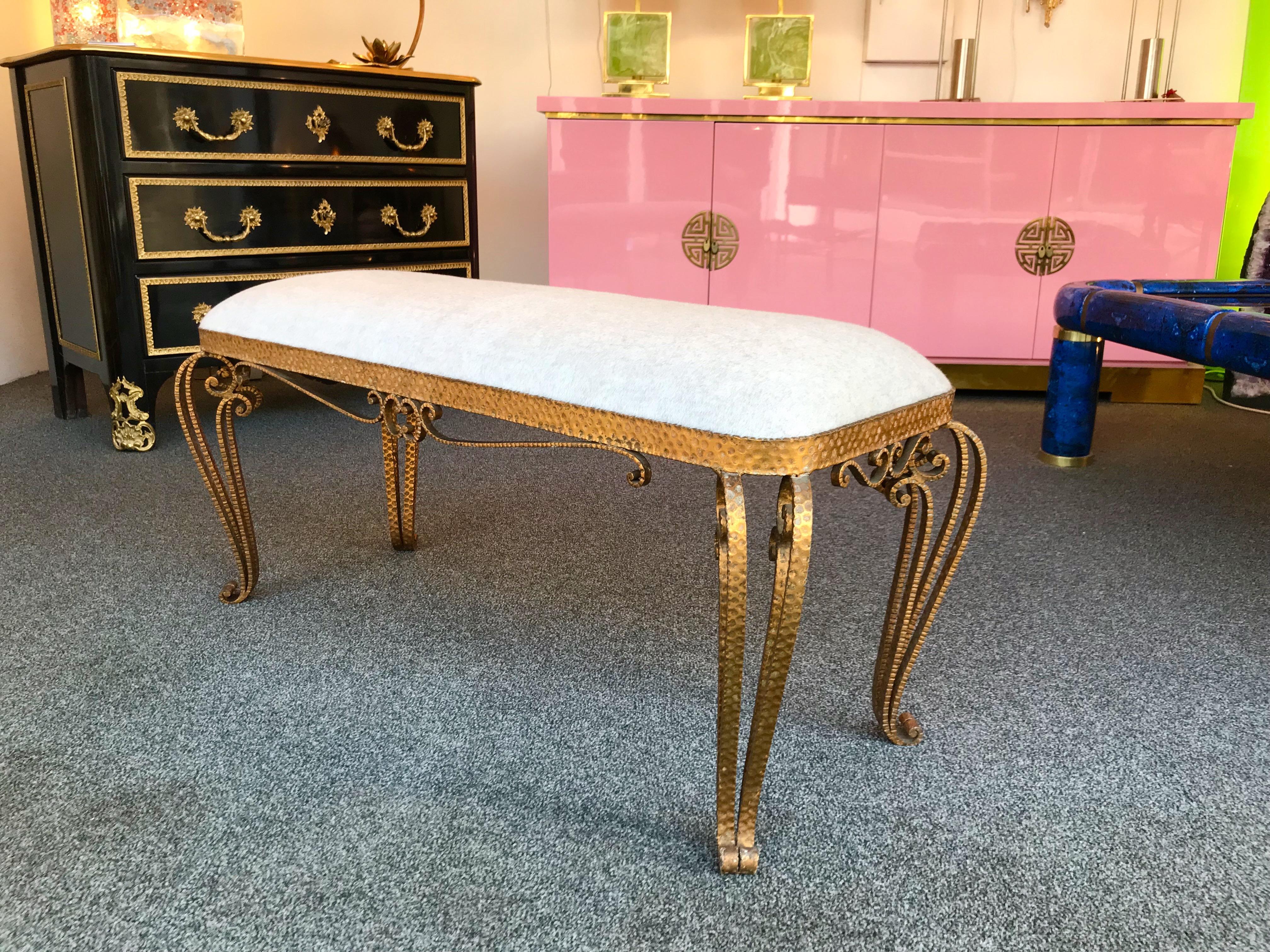 Very fine model of bench by Pier Luigi Colli. Hammered wrought iron and gold leaf . Fully upholstered with a lamb wool and cashmere wool fabric by Bisson Bruneel. The stools and console table are available on my storefront. Famous design like Maison