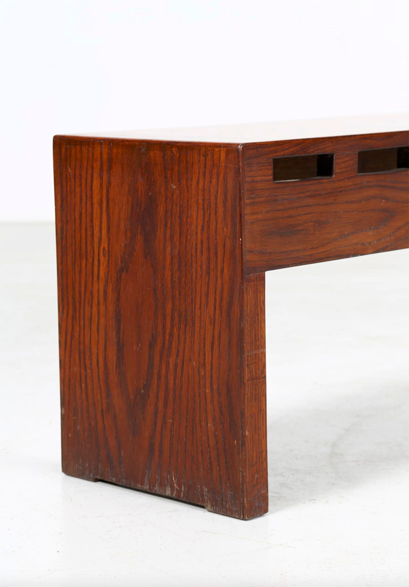 Rare bench created by Giuseppe Rivadossi, great Italian sculptor and designer. Its specialisation is the skilful working of wood.
The bench is made of rosewood. Made up of two side blocks and a central one, the bench is ideal for storing objects at