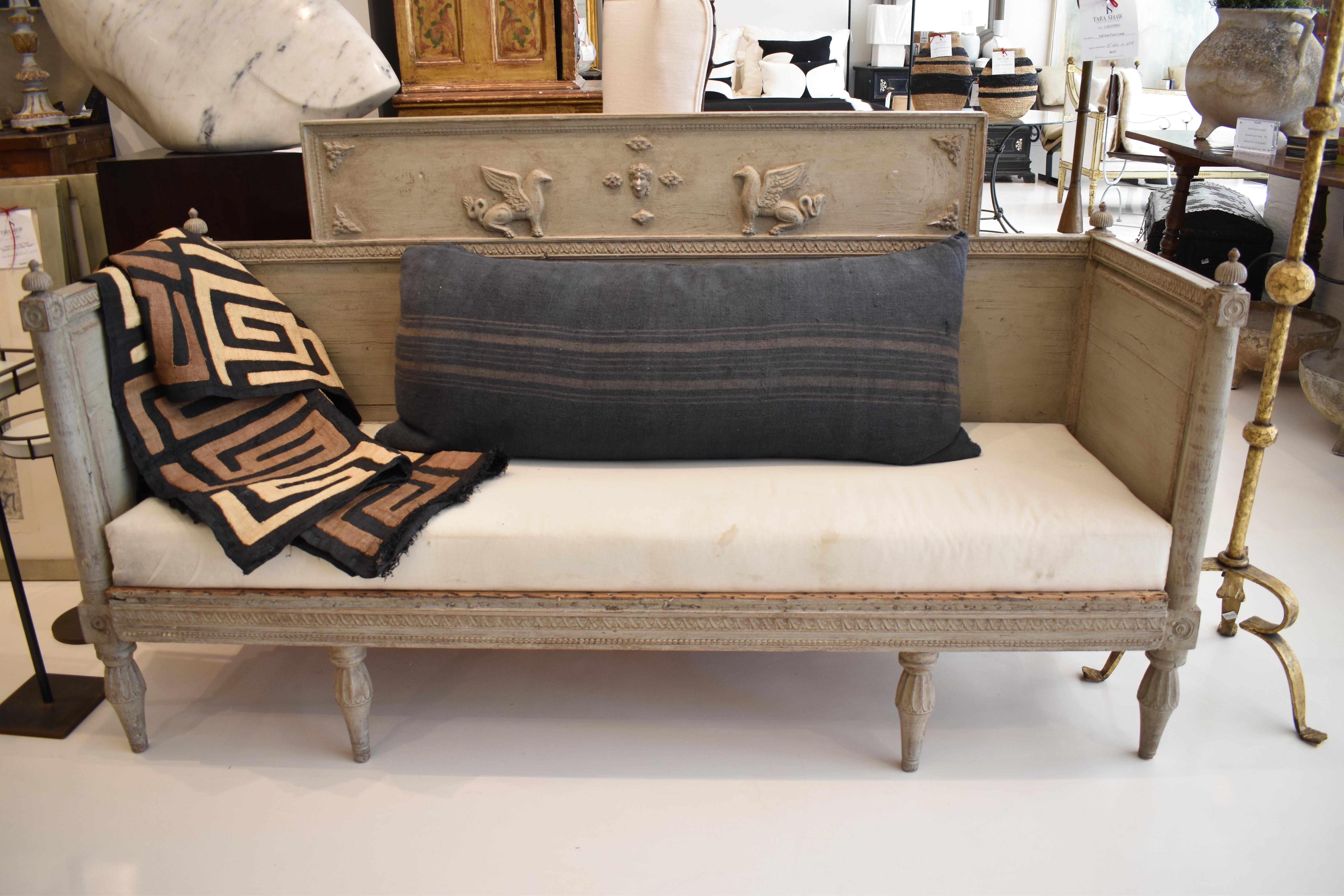 The relatively narrow seat on this Gustavian bench makes it perfect for a hallway or as secondary seating in a living room.  Simple lines with straight sides and back are decorated with small fluted finials on all four corners.  The back has an