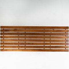 Bench with wooden slats and metal base, Harry Bertoia Bench with wooden slats