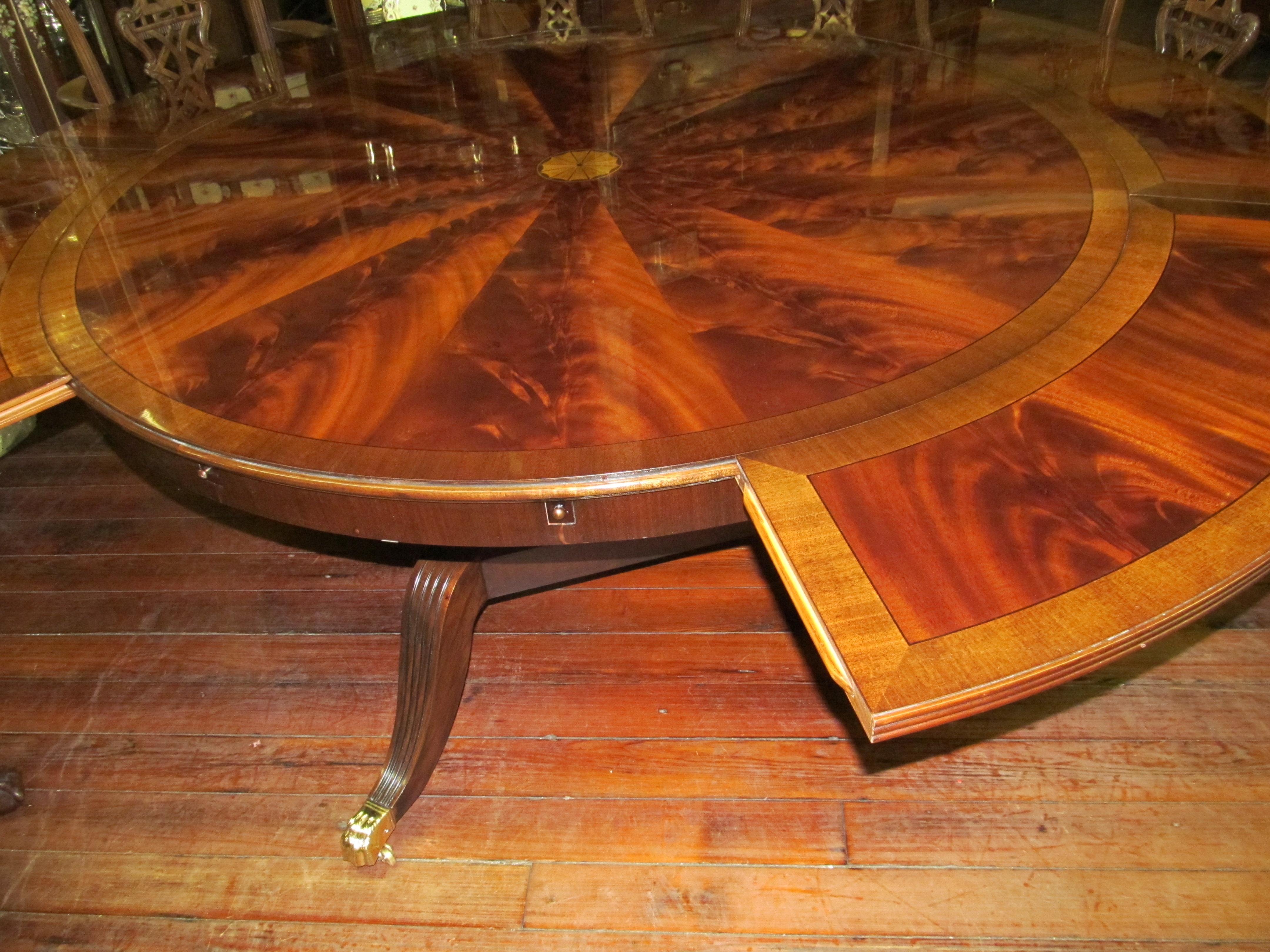 Benchmade Bookmatched Flame Mahogany Perimeter Leaf Circular Dining Table For Sale 10