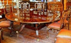 Benchmade Bookmatched Flame Mahogany Perimeter Leaf Circular Dining Table