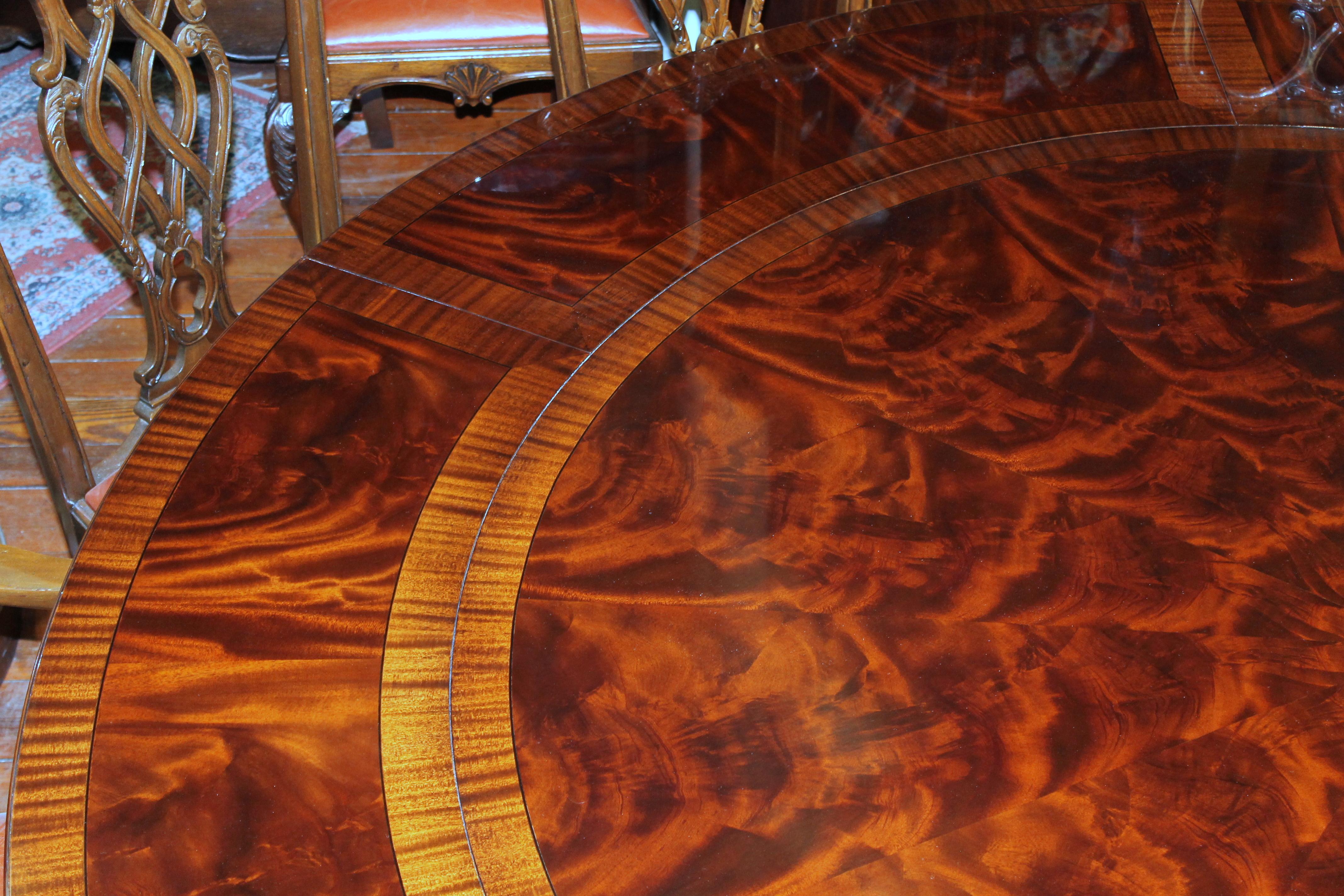 Benchmade Bookmatched Flame Mahogany Perimeter Leaf Circular Dining Table In Excellent Condition In Charleston, SC