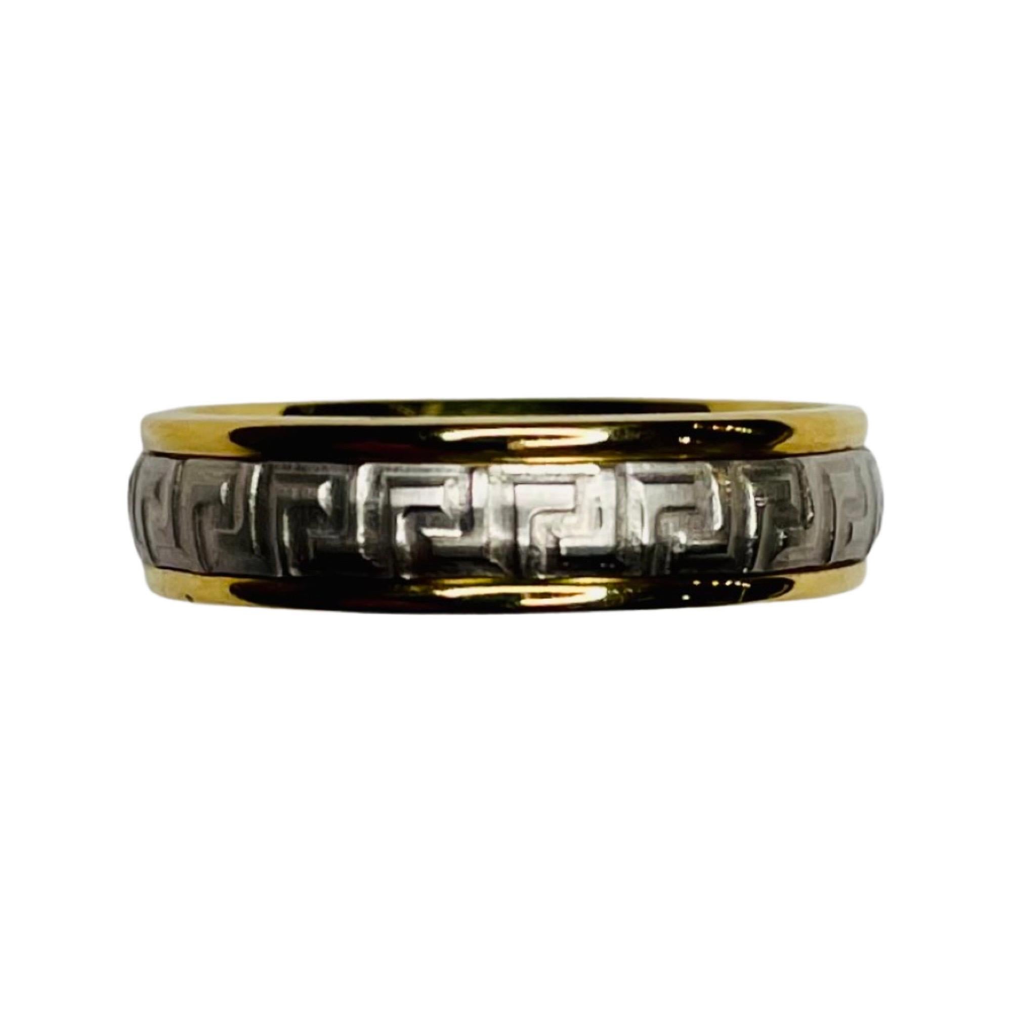 Benchmark 18K Yellow Gold and Platinum Wedding Band. This is a comfort fit band. The band is 18KY Gold on the outside and Platinum on the inside.  The yellow gold has a high polish finish and the platinum has a matte finish. It has the Greek key